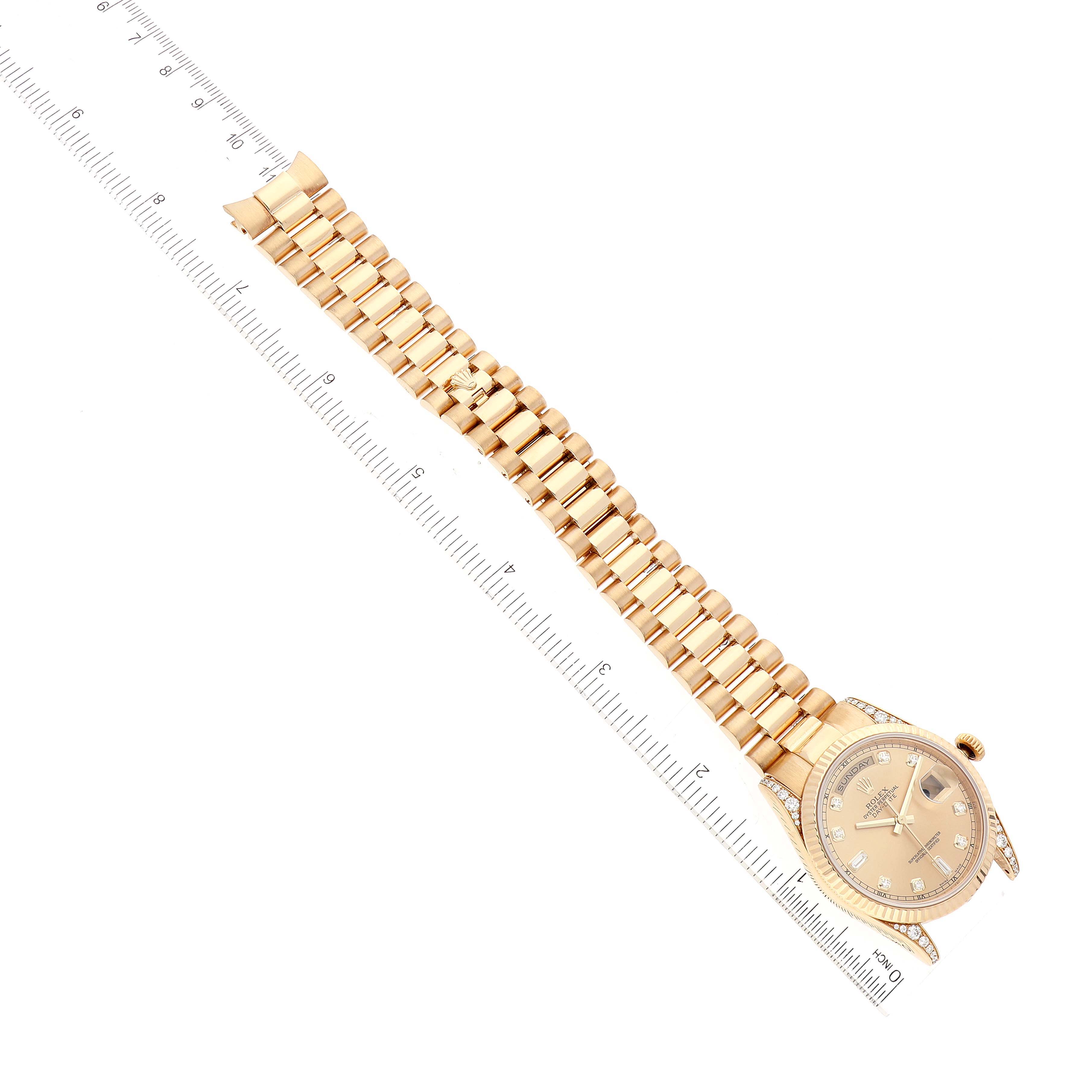 The image shows a Rolex President 118338 Men
s Yellow Gold Champagne Dial 118338 Men
s Yellow Gold Champagne Dial model watch laid flat next to a ruler, highlighting its full bracelet and face.