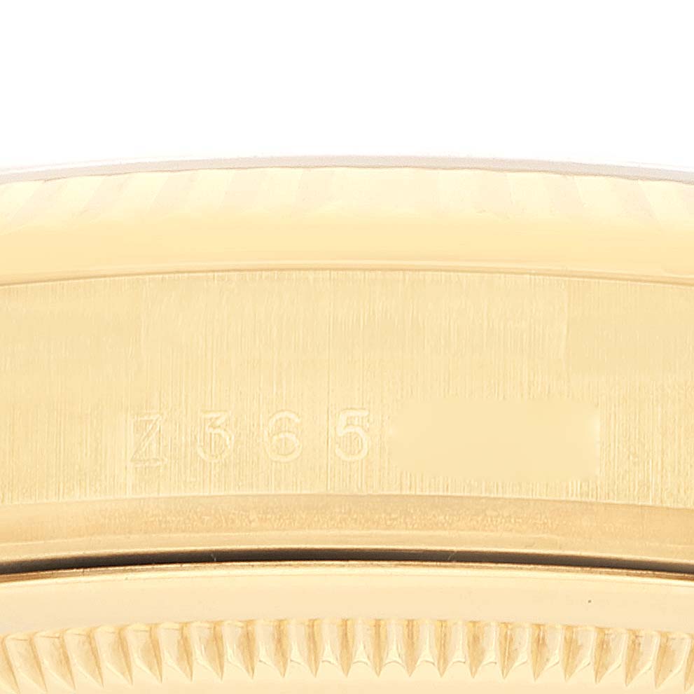 This image shows a close-up of the side and bezel of a Rolex President 118338 Men
s Yellow Gold Champagne Dial 118338 Men
s Yellow Gold Champagne Dial model watch.