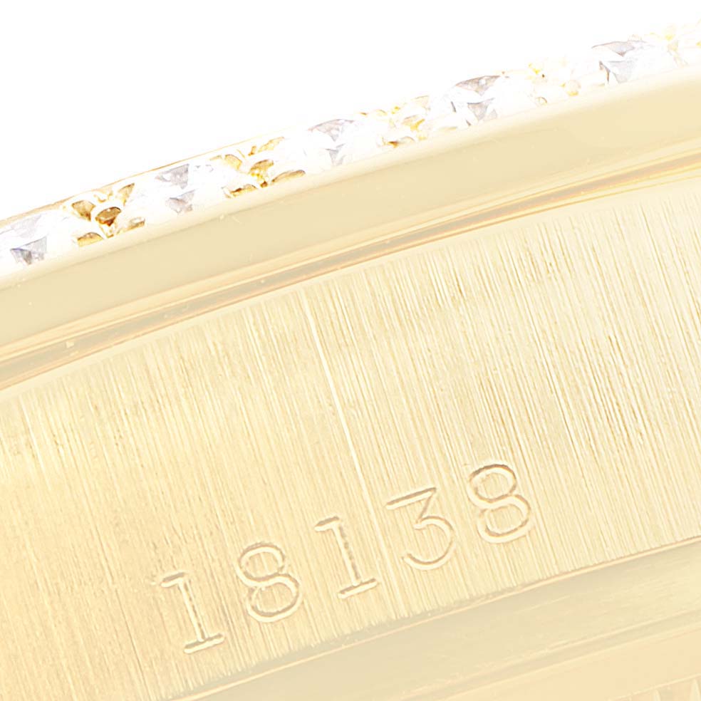 This close-up image shows the gold bezel and case with the model number "18138" engraved on a Rolex President 18138 Men
s Yellow Gold Champagne Dial 18138 Men
s Yellow Gold Champagne Dial watch.