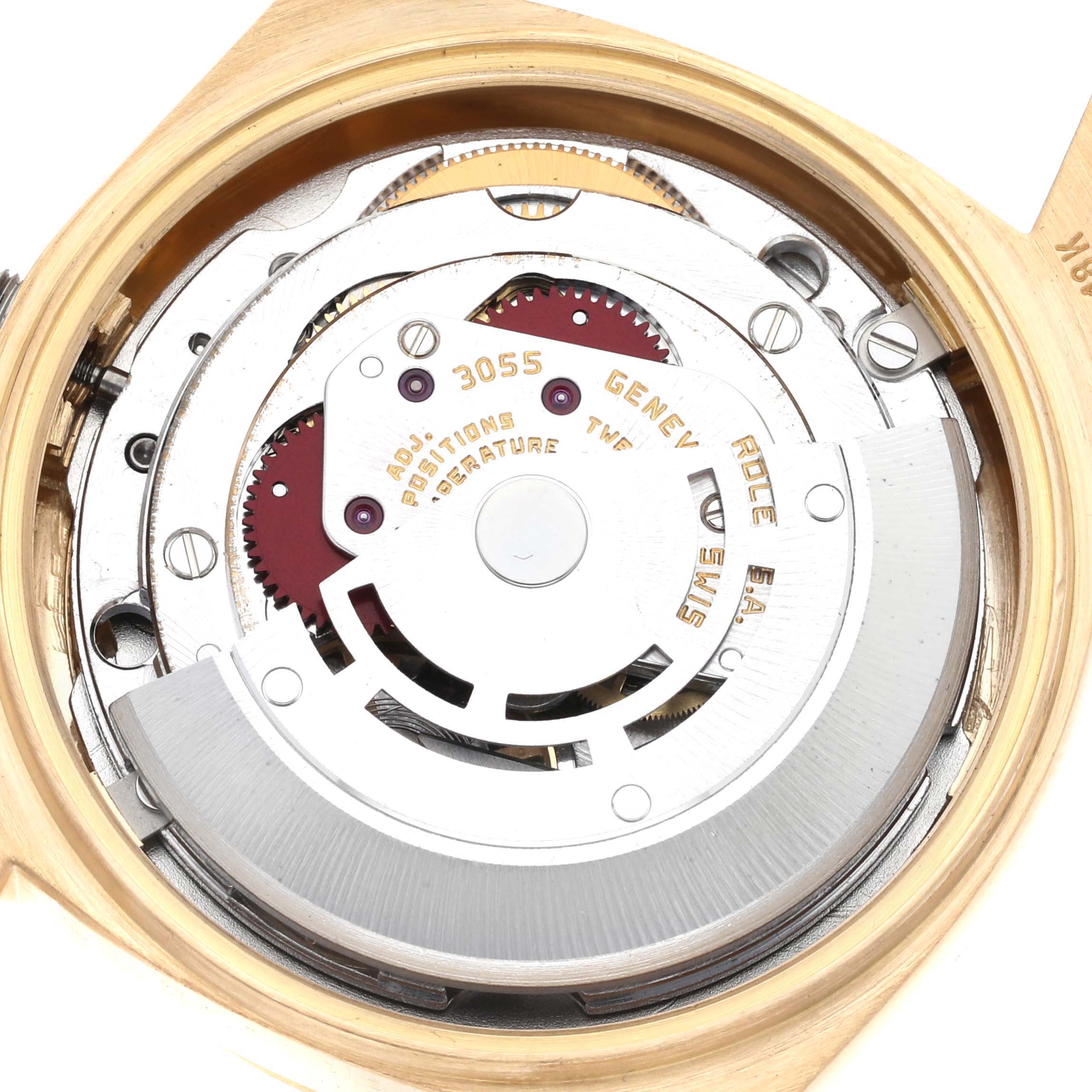 The image shows the internal movement of a Rolex President 18078A Men's Yellow Gold Champagne Dial 18078A Men's Yellow Gold Champagne Dial model, viewed from the back, highlighting gears and mechanisms.