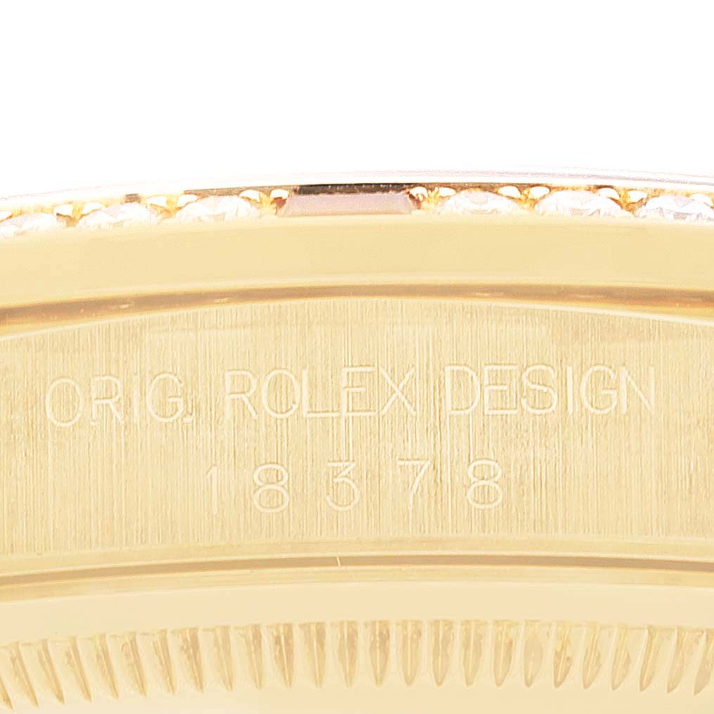 This image shows a close-up of the engraved side of the case of a Rolex President 18378 Men
s Yellow Gold Champagne Dial 18378 Men
s Yellow Gold Champagne Dial model watch.