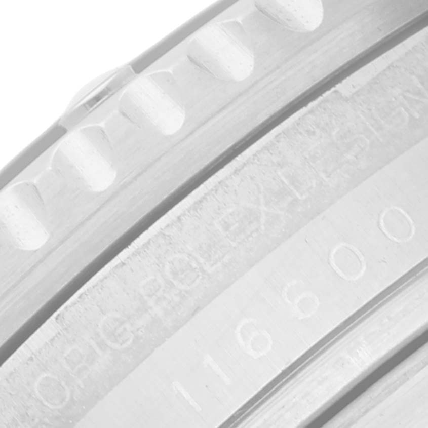 This image shows a close-up of the bezel and engraved inner ring of a Rolex Sea-Dweller 116600 Men
s Stainless Steel Black Dial 116600 Men
s Stainless Steel Black Dial watch.