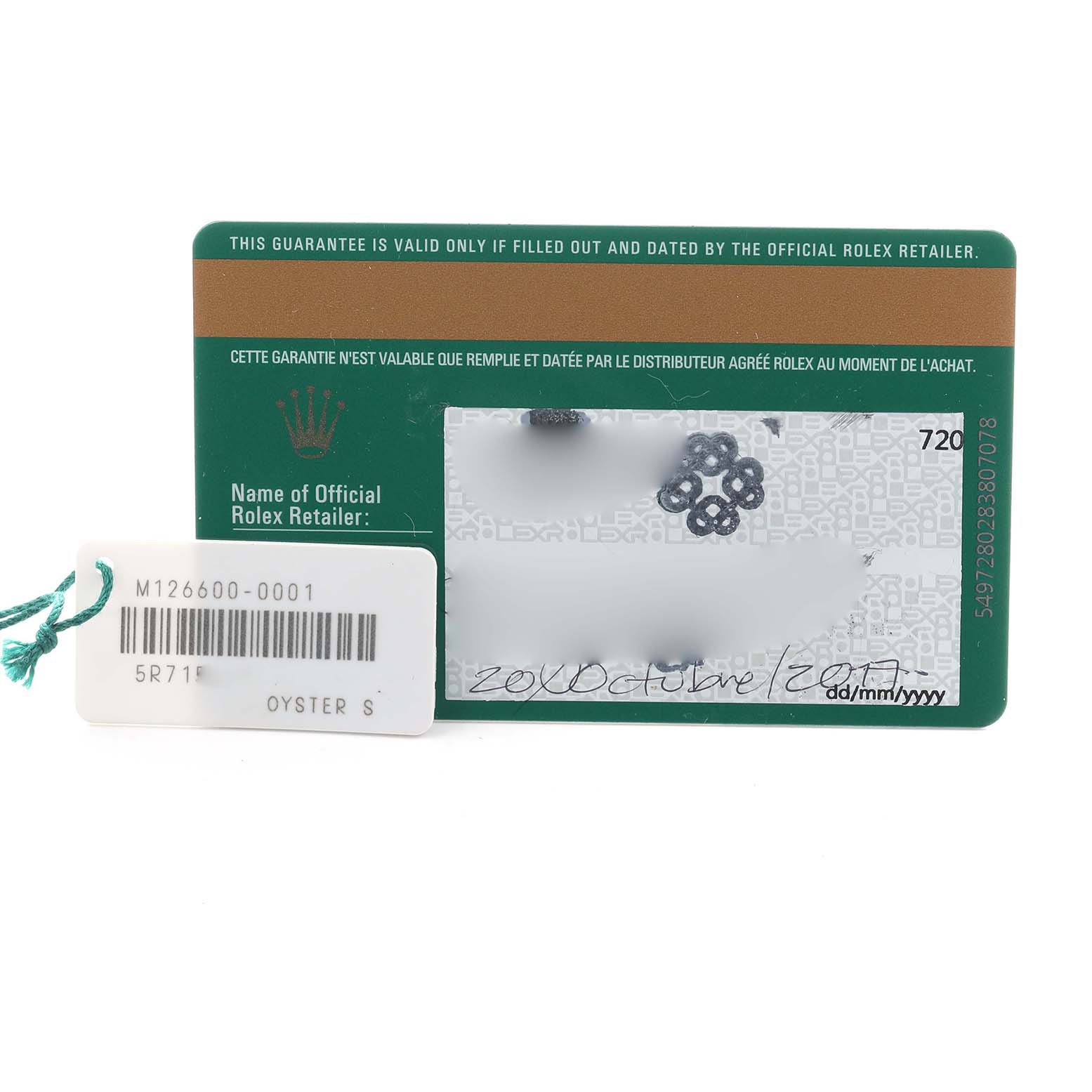 The image shows a Rolex Sea-Dweller 126600 Men's Stainless Steel Black Dial warranty card and a label with model and serial information.