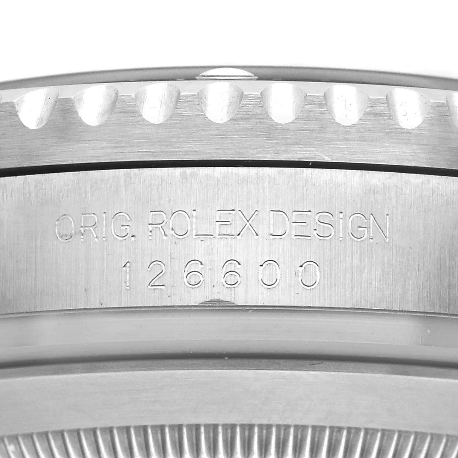 The image shows a close-up of the side of the Rolex Sea-Dweller 126600 Men's Stainless Steel Black Dial's case, featuring the "ORIG. ROLEX DESIGN 126600" engraving.
