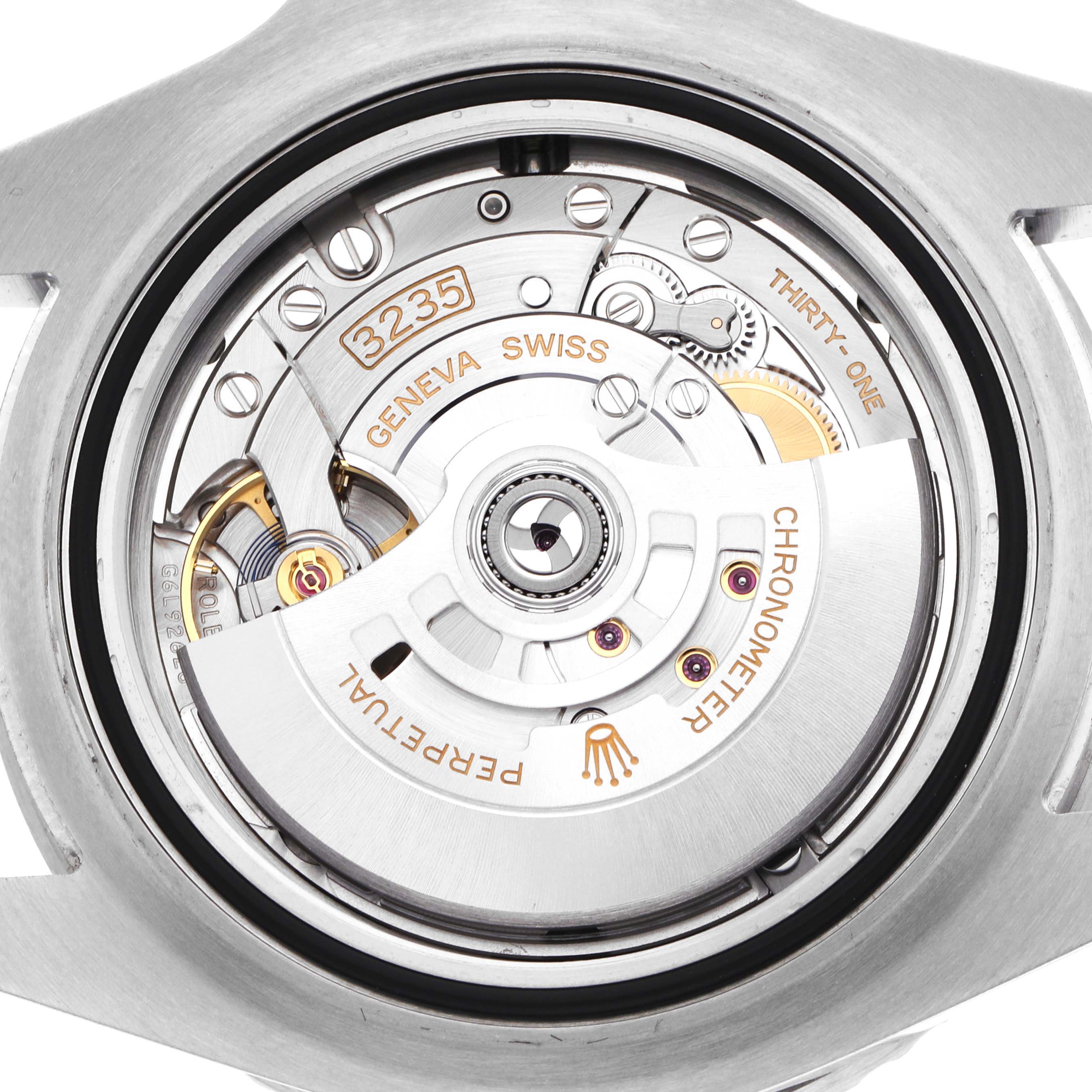 The image shows the movement of a Rolex Sea-Dweller 126600 Men's Stainless Steel Black Dial watch from the back, highlighting the intricate mechanism and rotor.