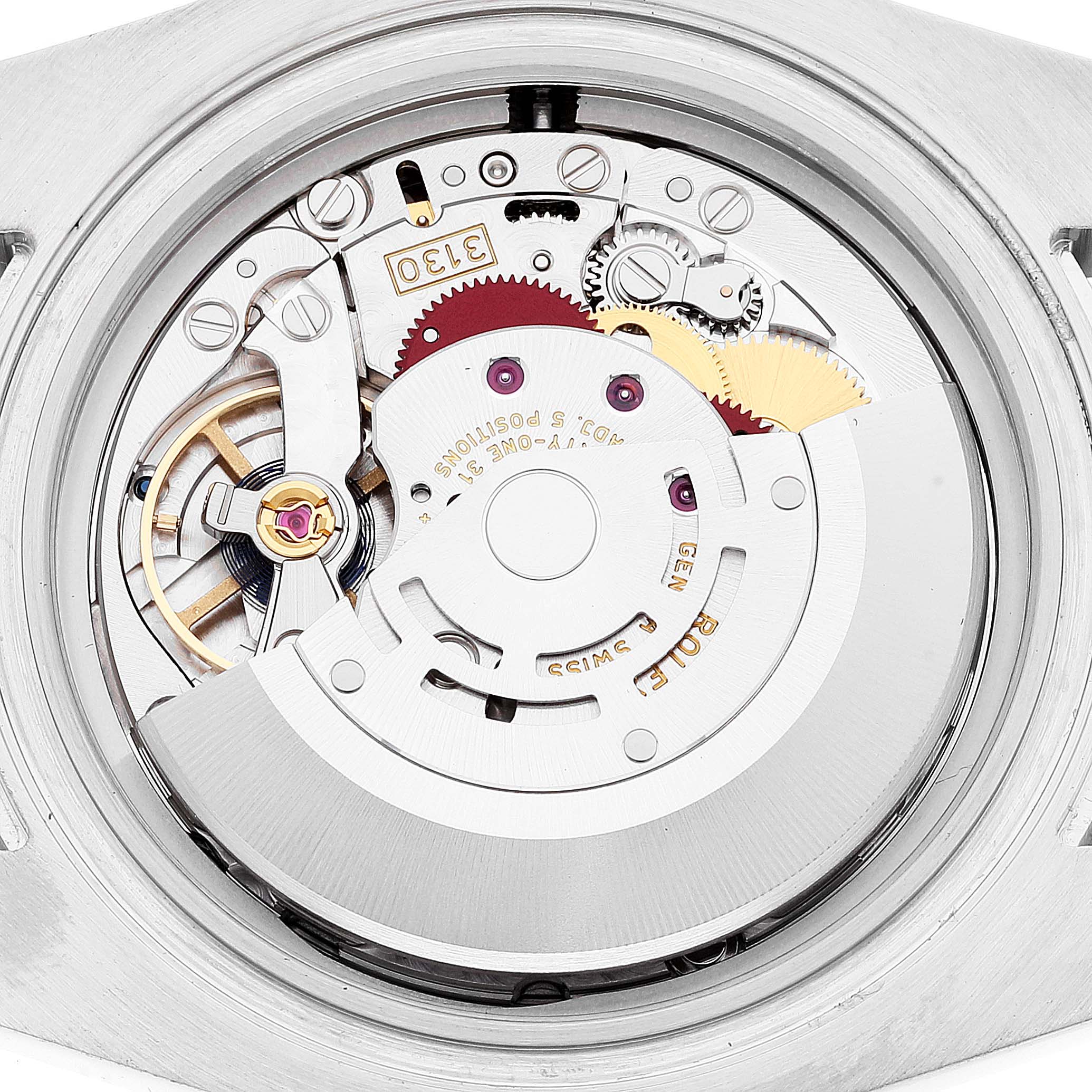 The image shows the internal movement mechanism of a Rolex Submariner 114060 Men
s Stainless Steel Black Dial 114060 Men
s Stainless Steel Black Dial watch from a rear view angle.