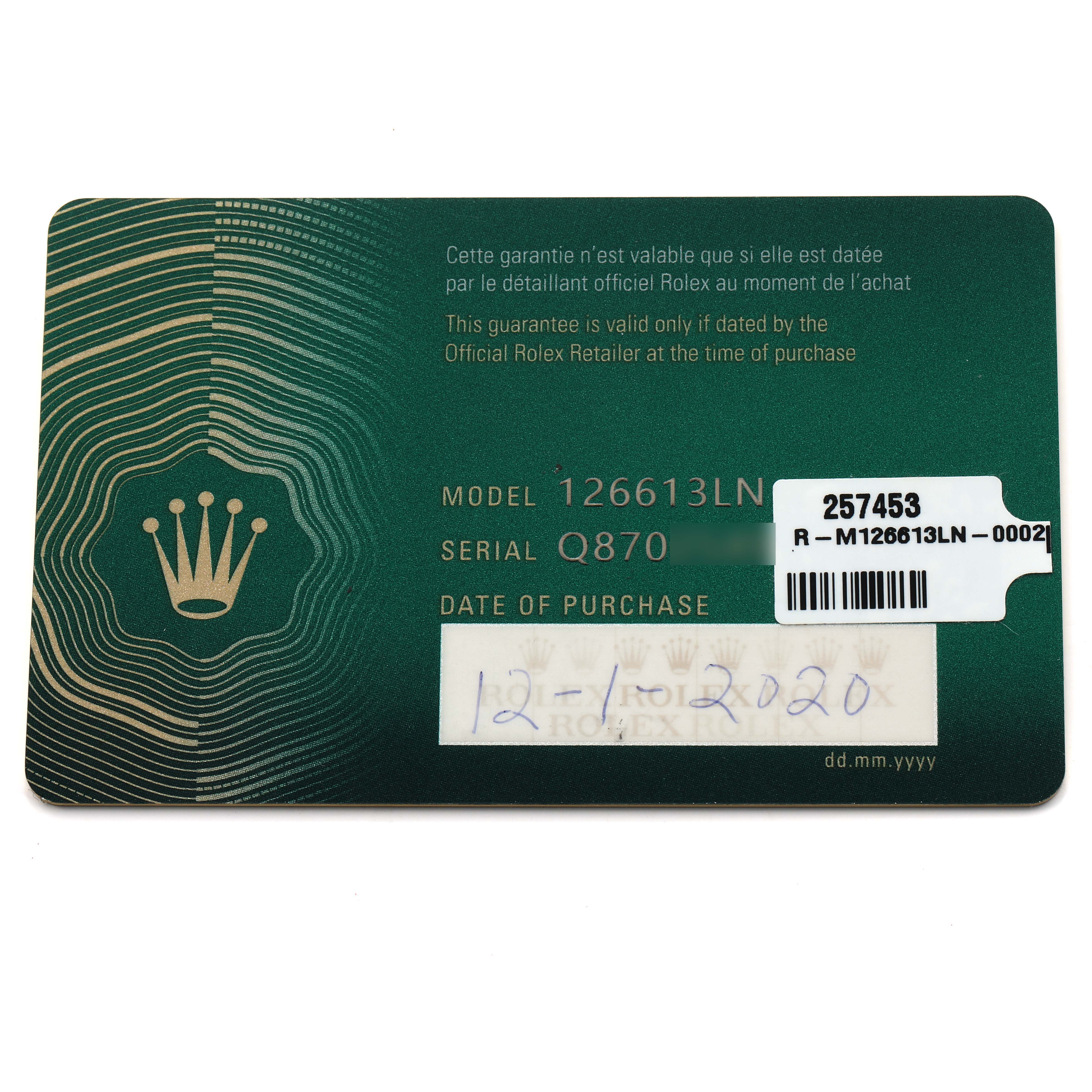 The image shows a warranty card for a Rolex Submariner 126613 Men
s Steel and Gold (two tone) Black Dial model, displaying the model, serial number, and purchase date.