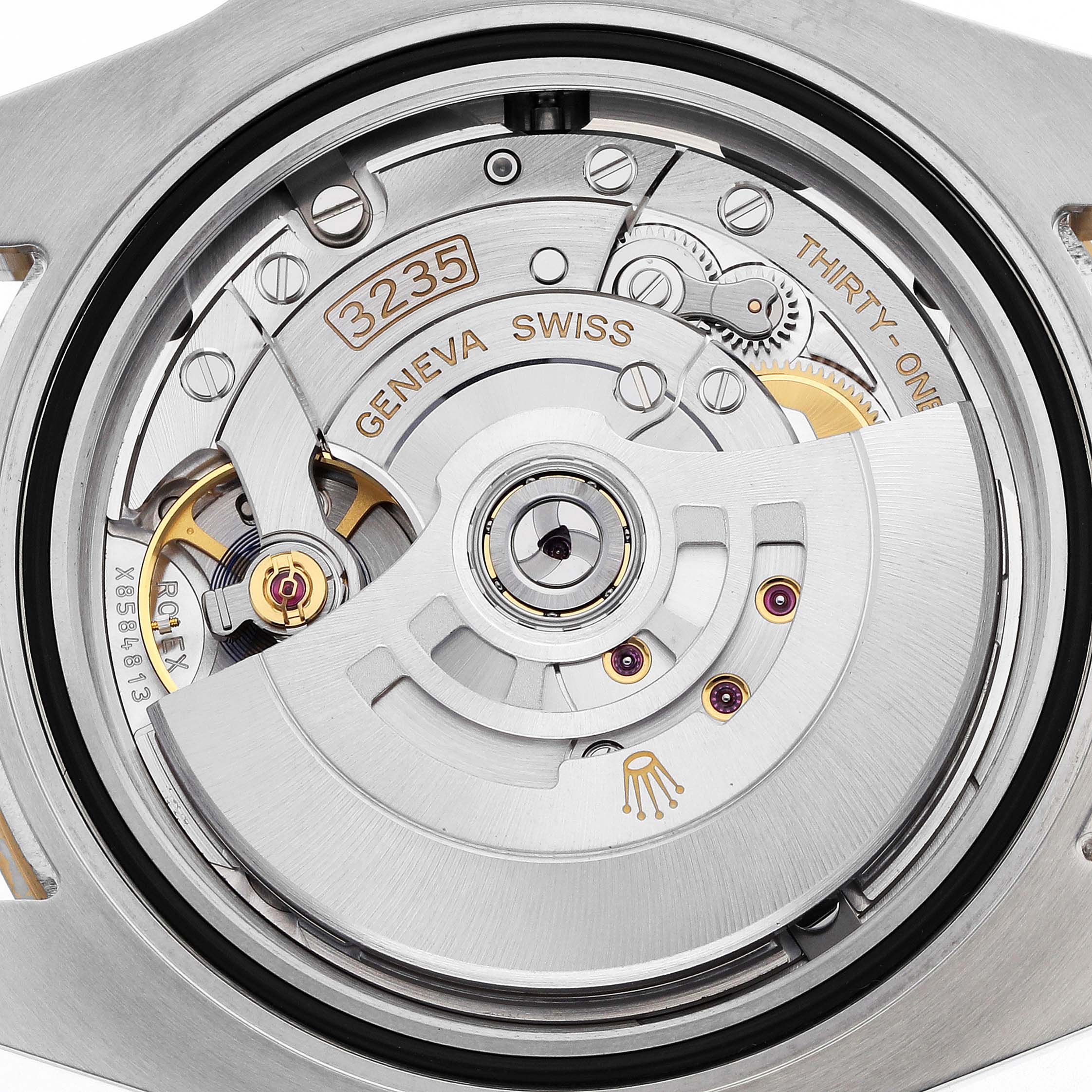 The image shows the movement of a Rolex Submariner 126613 Men
s Steel and Gold (two tone) Black Dial watch from a top-down angle, highlighting its intricate mechanism.