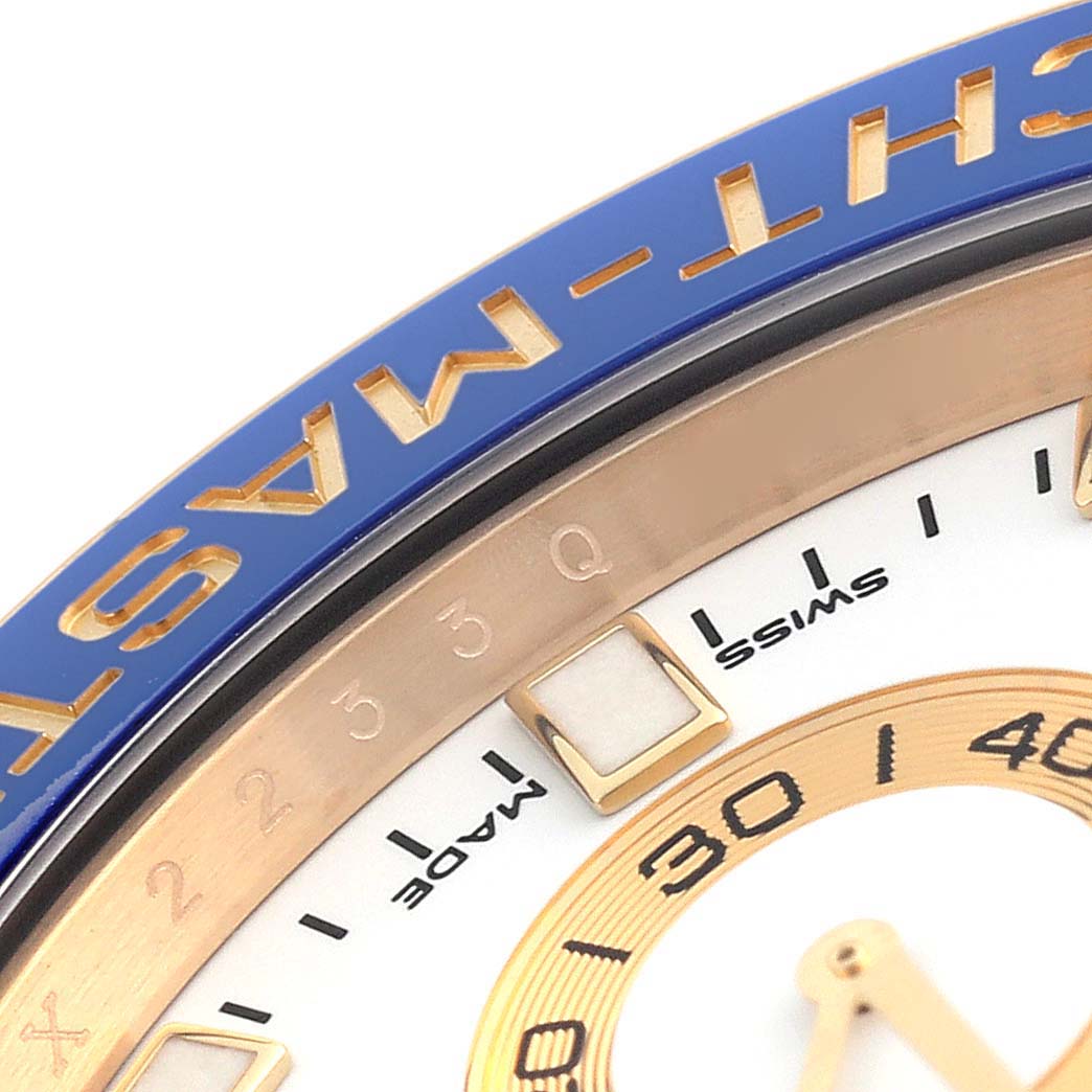 The image shows a close-up of the bezel, part of the dial, and markers of the Rolex Yacht-Master 116688 Men's Yellow Gold White Dial 116688 Men's Yellow Gold White Dial watch.