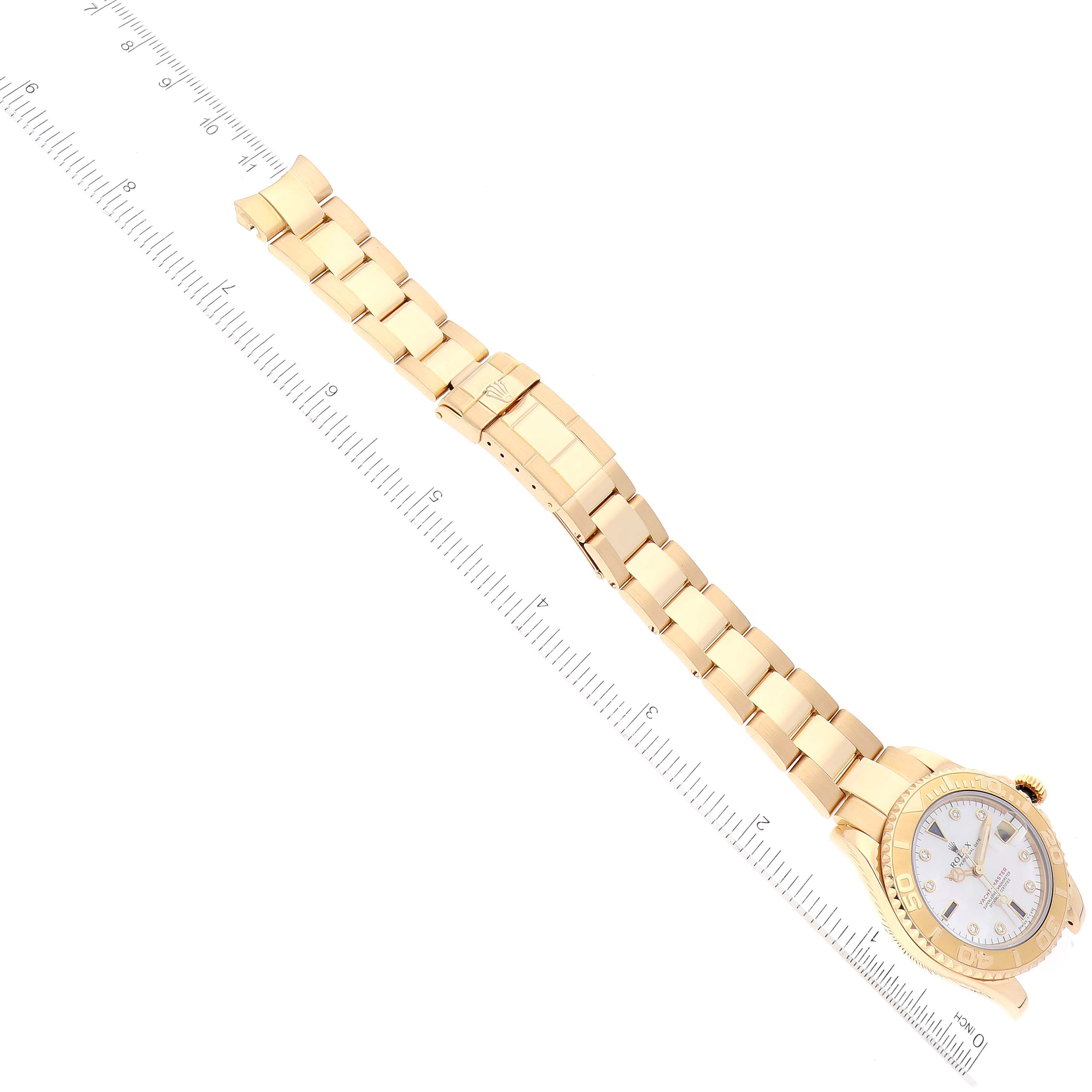 The image shows a Rolex Yacht-Master 68628 Men's Yellow Gold Mother of Pearl Dial 68628 Men's Yellow Gold Mother of Pearl Dial watch at an angled view, displaying the face, bezel, and full bracelet with a ruler for scale.