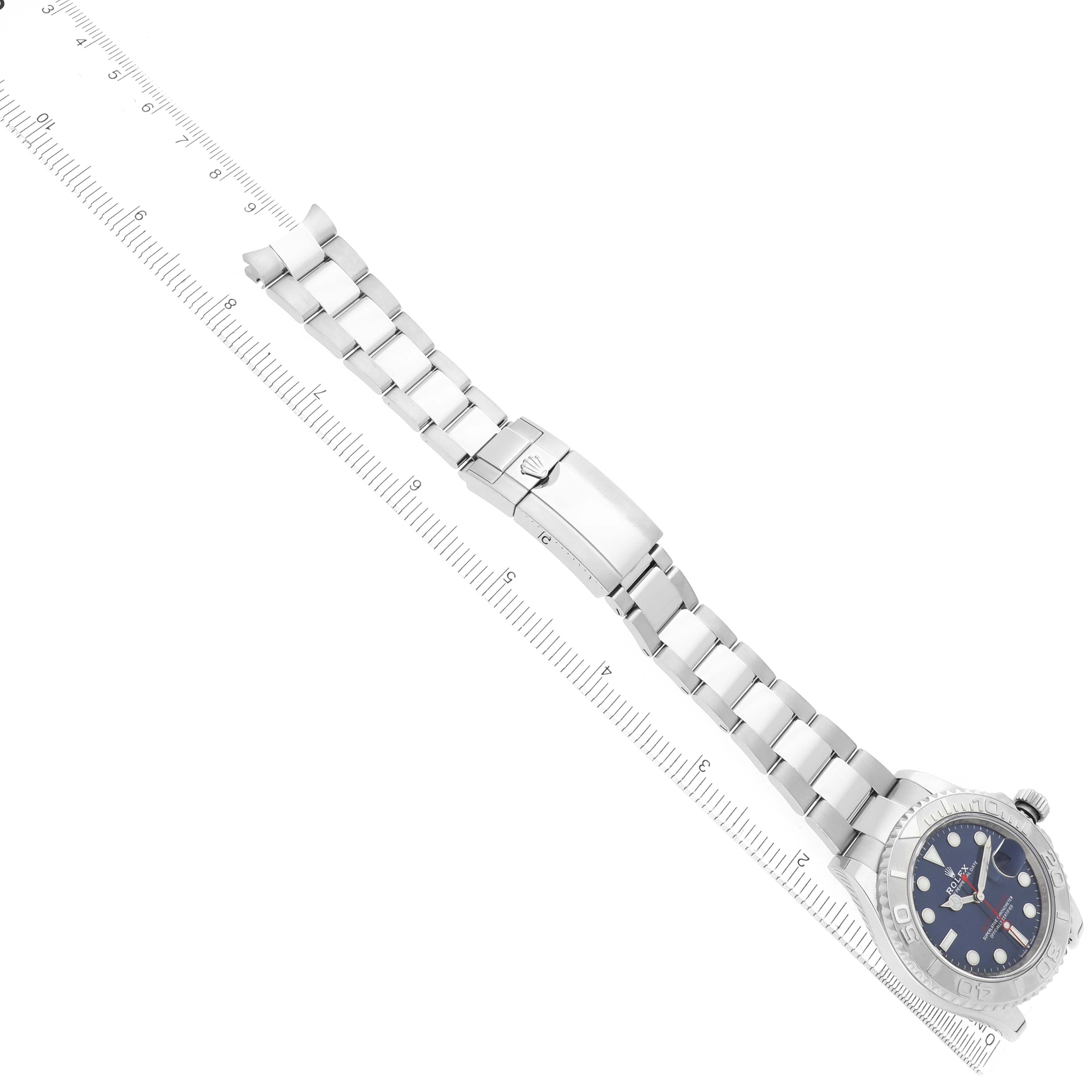 The image shows a Rolex Yacht-Master 126622 Men
s Stainless Steel Blue Dial watch at a diagonal angle, highlighting the bracelet and clasp alongside a ruler for measurement.