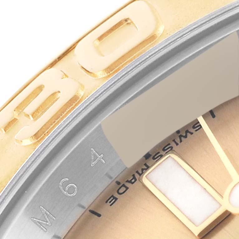 This close-up image shows the bezel and part of the dial of the Rolex Yacht-Master 16623 Men's Steel and Gold (two tone) Champagne Dial 16623 Men's Steel and Gold (two tone) Champagne Dial watch.