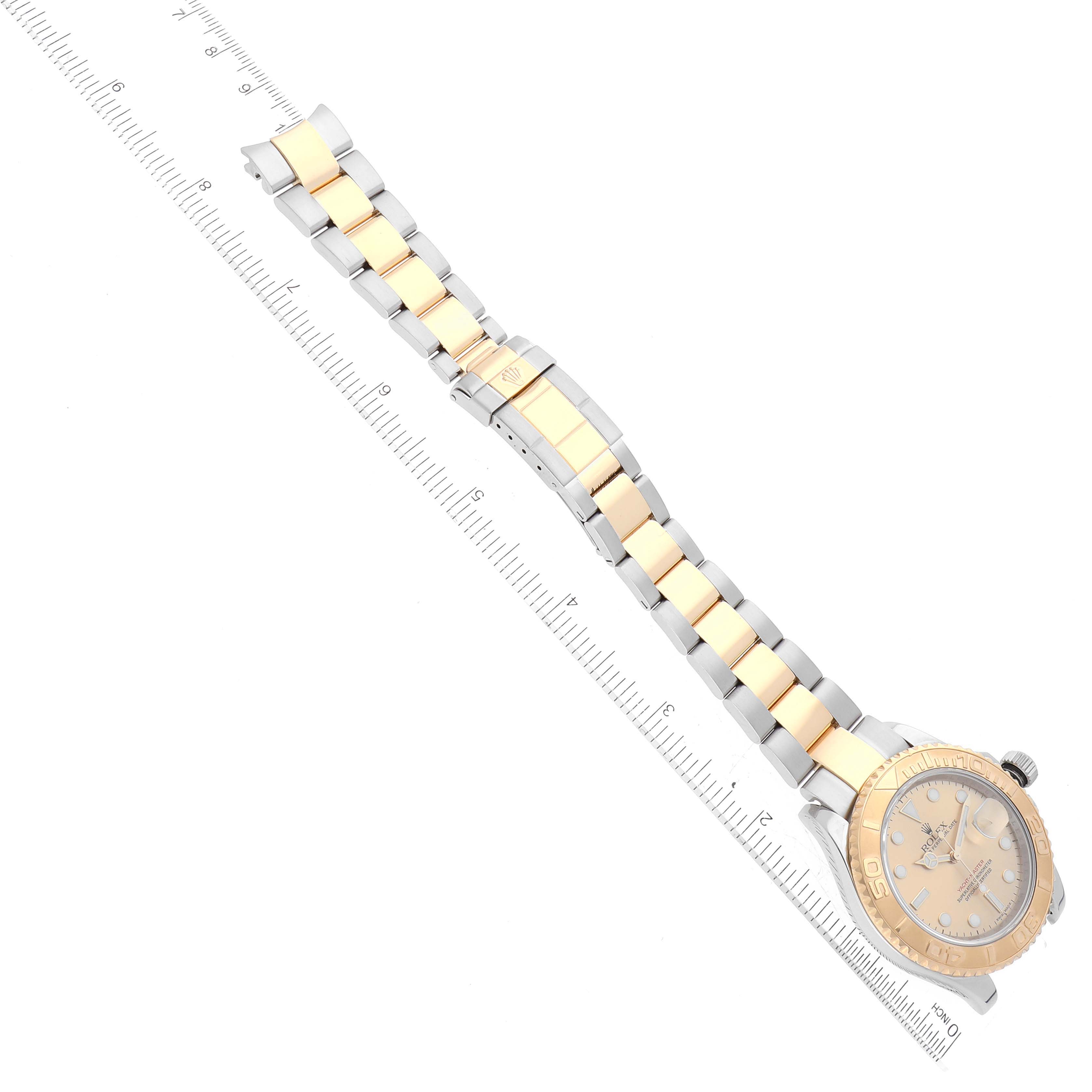 The image shows a top-down view of the Rolex Yacht-Master 16623 Men's Steel and Gold (two tone) Champagne Dial 16623 Men's Steel and Gold (two tone) Champagne Dial watch, highlighting its bracelet and dial.