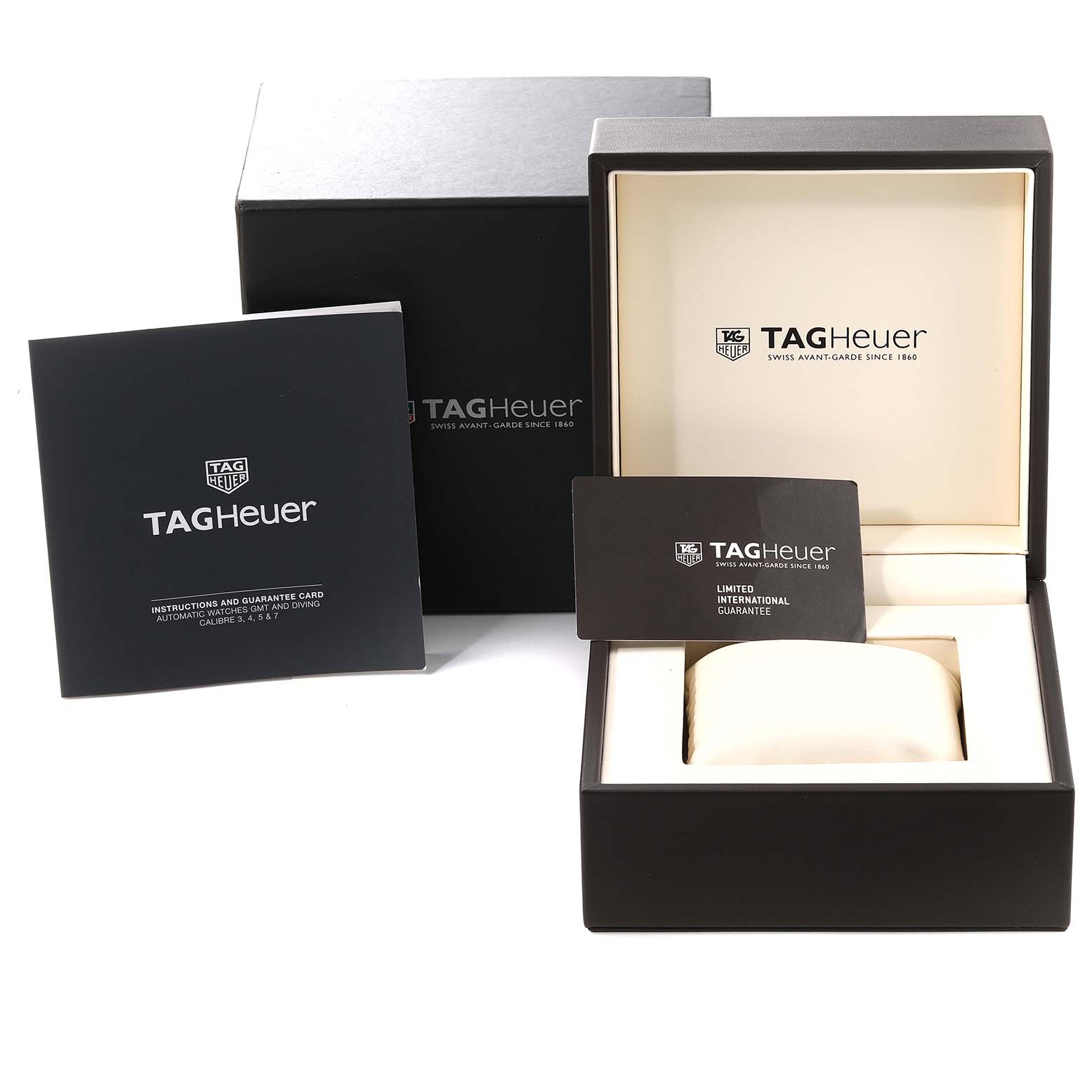 The image shows the packaging, instruction manual, and warranty card for a Tag Heuer Carrera CAR2A1Z Men's Stainless Steel Black Dial CAR2A1Z Men's Stainless Steel Black Dial model watch.