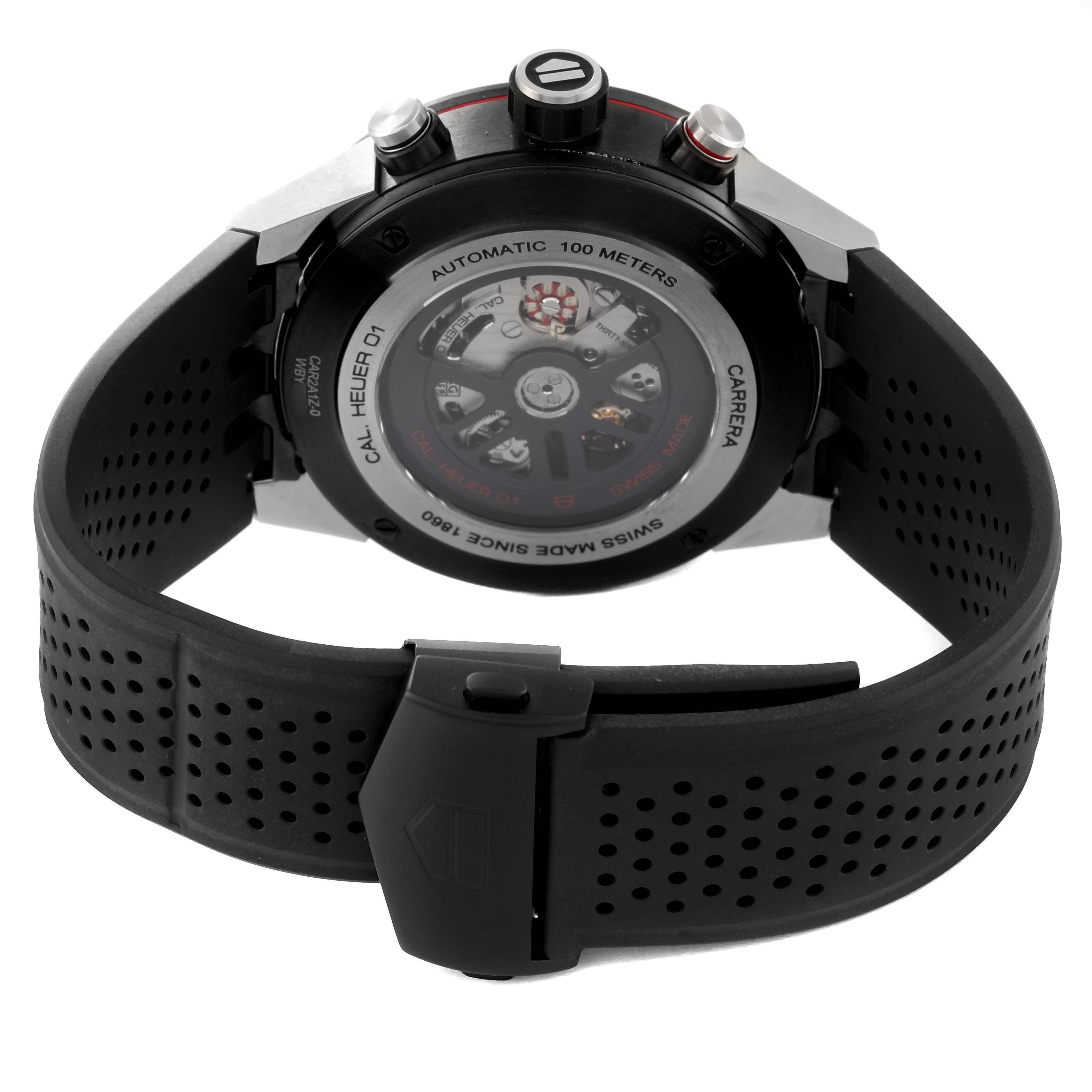 The image shows the back of a Tag Heuer Carrera CAR2A1Z Men's Stainless Steel Black Dial CAR2A1Z Men's Stainless Steel Black Dial watch, highlighting its transparent case back and black perforated strap.