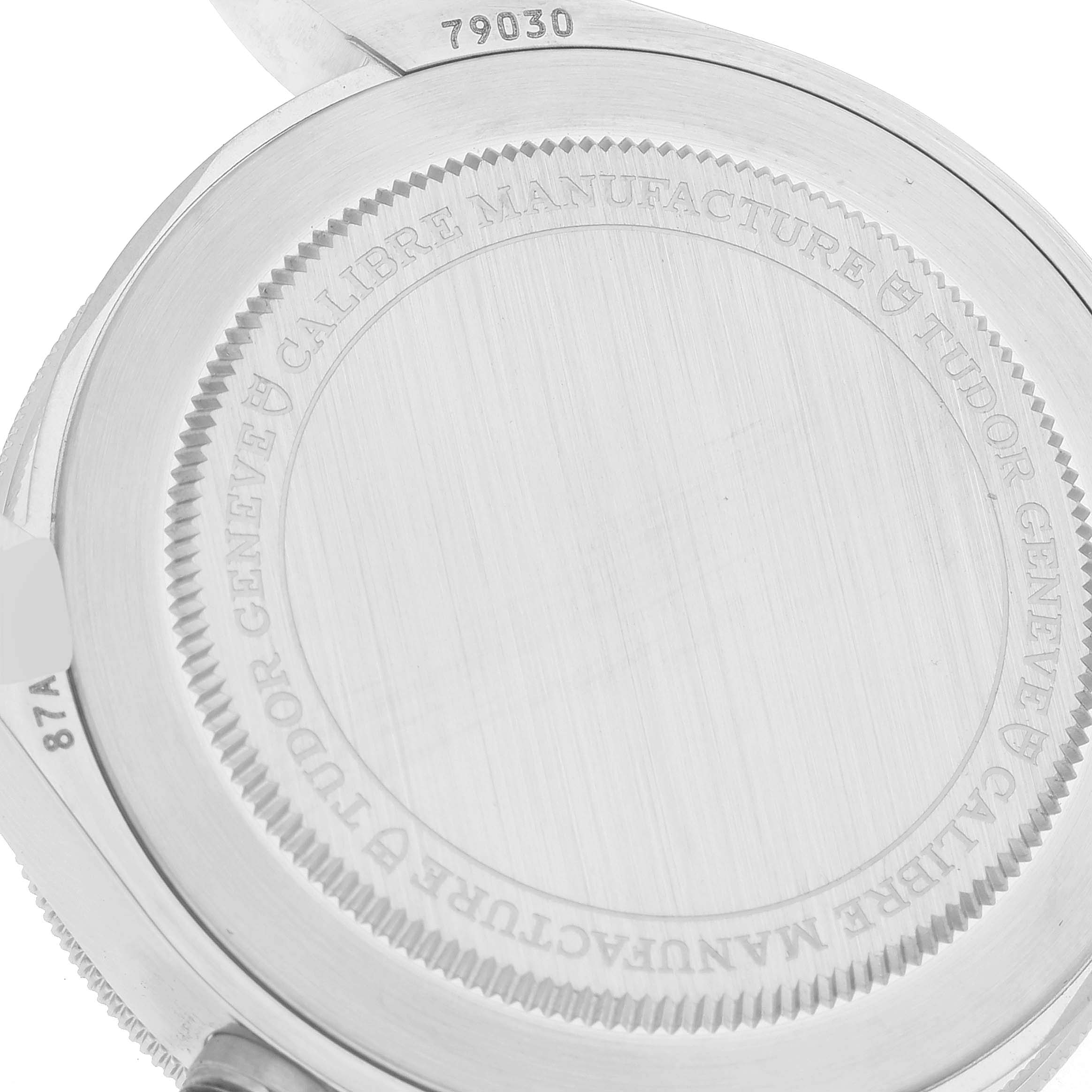 The image shows the engraved backside of the Tudor Heritage Black Bay M79030N-0001 Men
s Stainless Steel Black Dial M79030N-0001 Men
s Stainless Steel Black Dial model watch, showcasing the serial number and inscriptions.