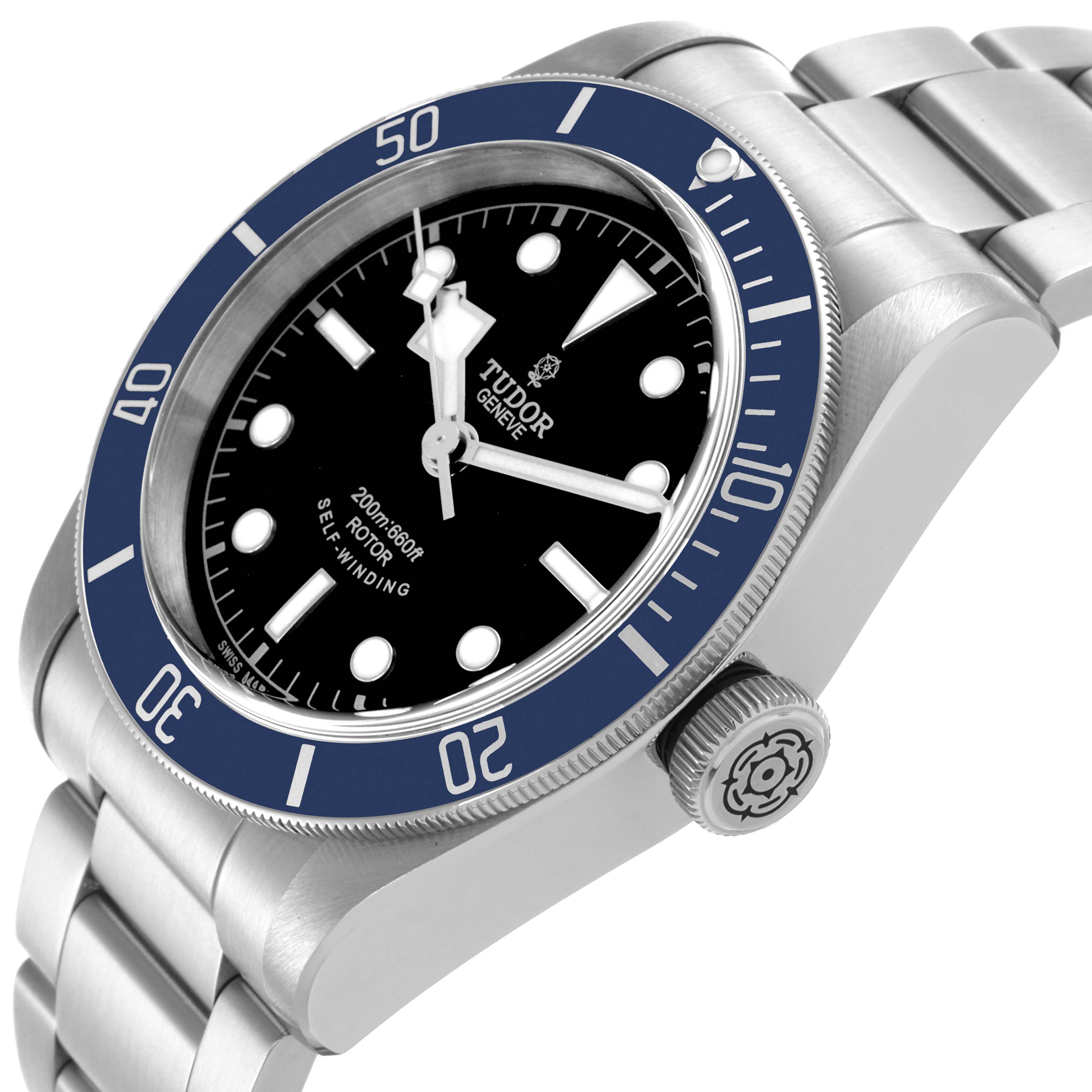 The Tudor Heritage Black Bay 79220B Men
s Stainless Steel Black Dial 79220B Men
s Stainless Steel Black Dial watch is shown at a three-quarter angle, highlighting the face, bezel, crown, and bracelet.