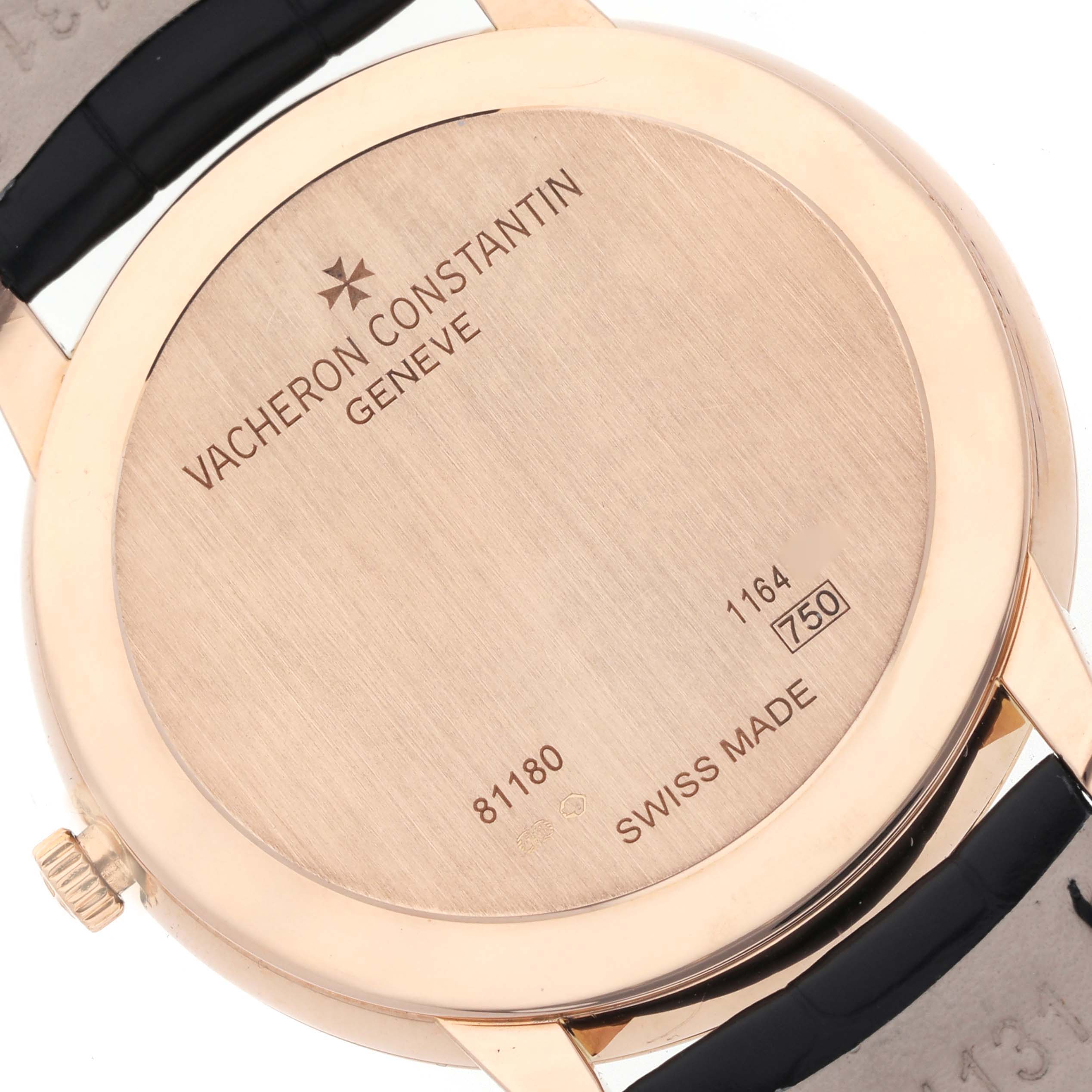 The image shows the case back of the Vacheron Constantin Patrimony 81180 Men's Rose Gold Black Dial 81180 Men's Rose Gold Black Dial watch, highlighting its engravings and strap attachment.