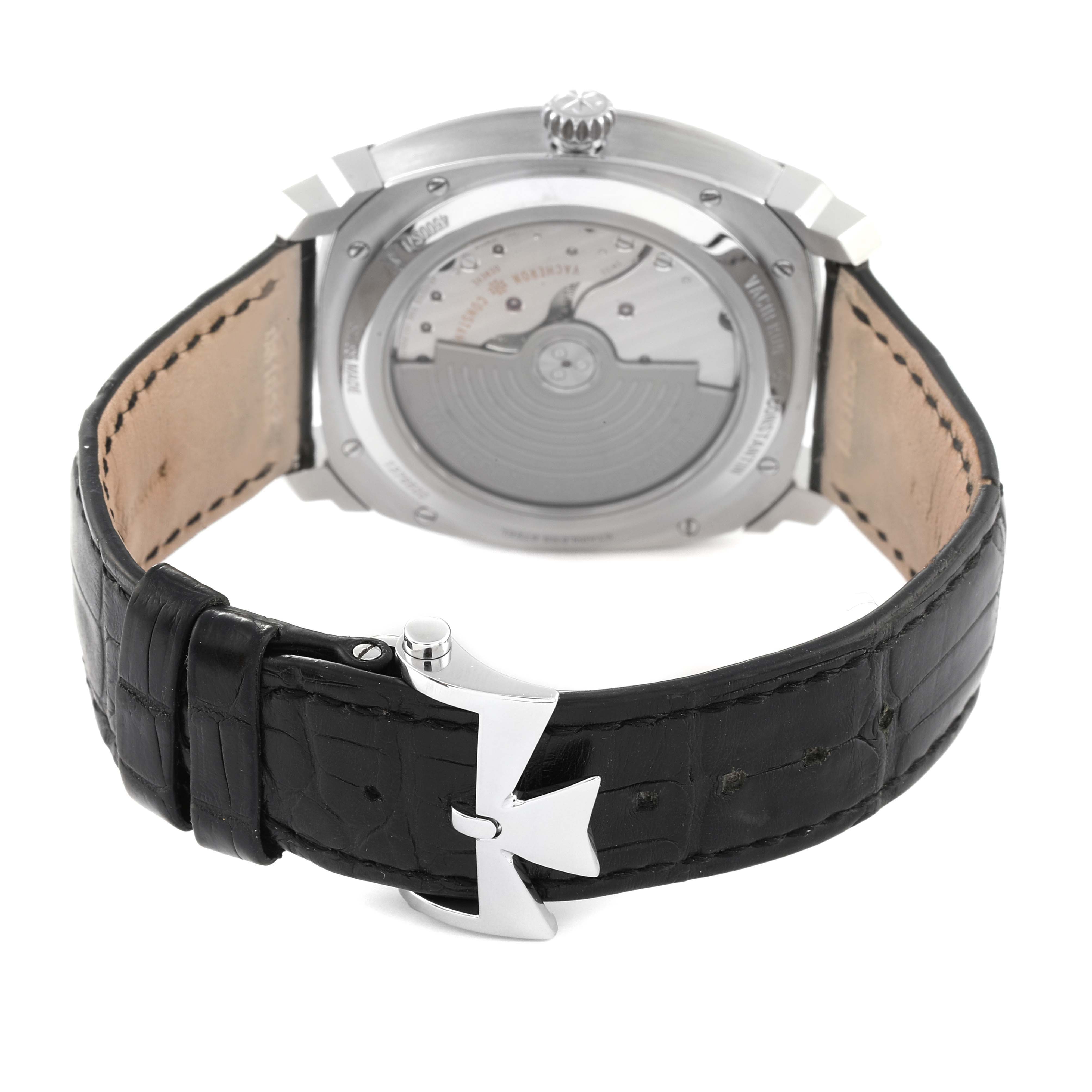 The image shows the back view of a Vacheron Constantin Quai de l'Ile watch, highlighting the open case back and black leather strap.