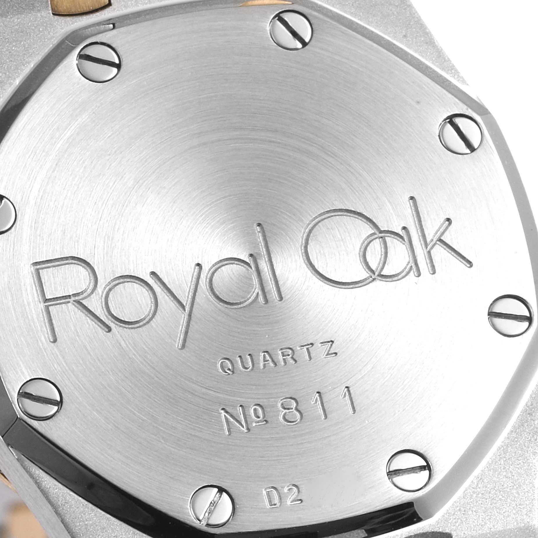 The image shows the case back of the Audemars Piguet Royal Oak 6271SA/902 Women's Steel and Gold (two tone) Champagne Dial 6271SA/902 Women's Steel and Gold (two tone) Champagne Dial watch, displaying its engraving, screws, and brushed metal finish.