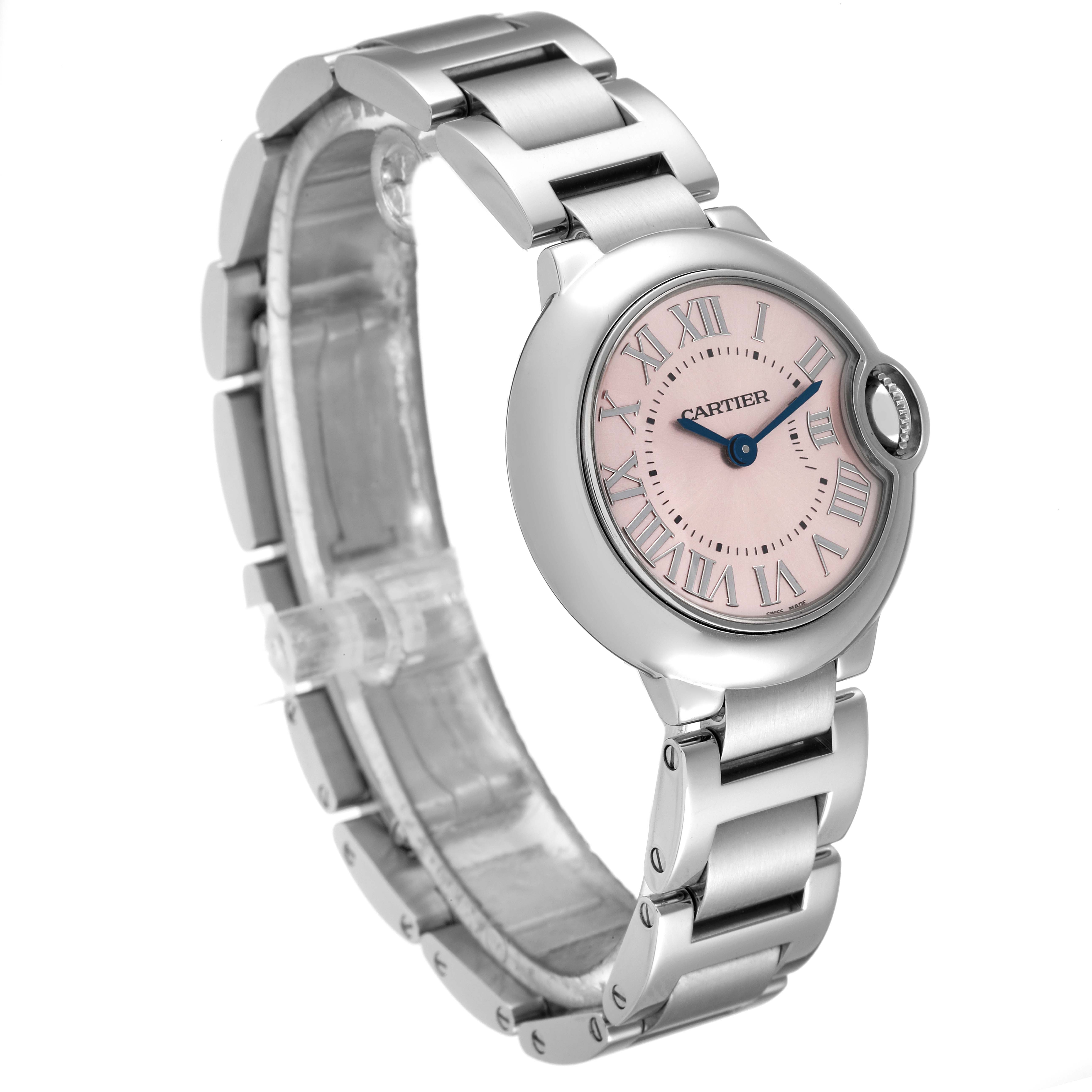 The image shows a side and front angle of the Cartier Ballon Bleu W6920038 Women
s Stainless Steel Pink Dial W6920038 Women
s Stainless Steel Pink Dial watch, highlighting its pink dial, blue hands, and metal bracelet.