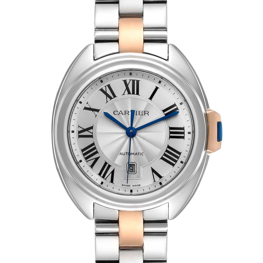 The Cartier Clé watch is shown from the front, highlighting the dial, Roman numerals, hands, and part of the bracelet.