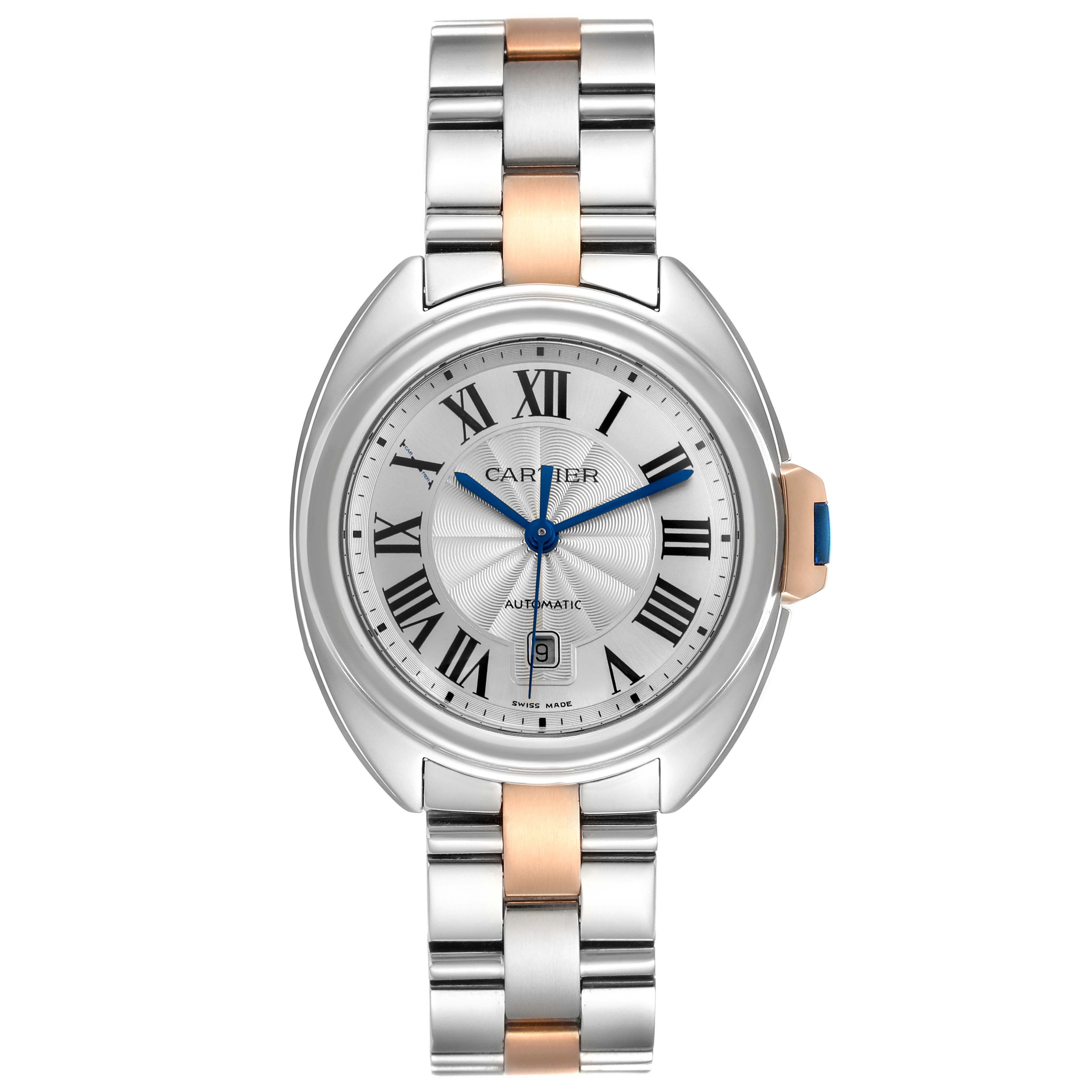 The Cartier Clé watch is shown from a front angle, highlighting its dial, hands, and two-tone bracelet.