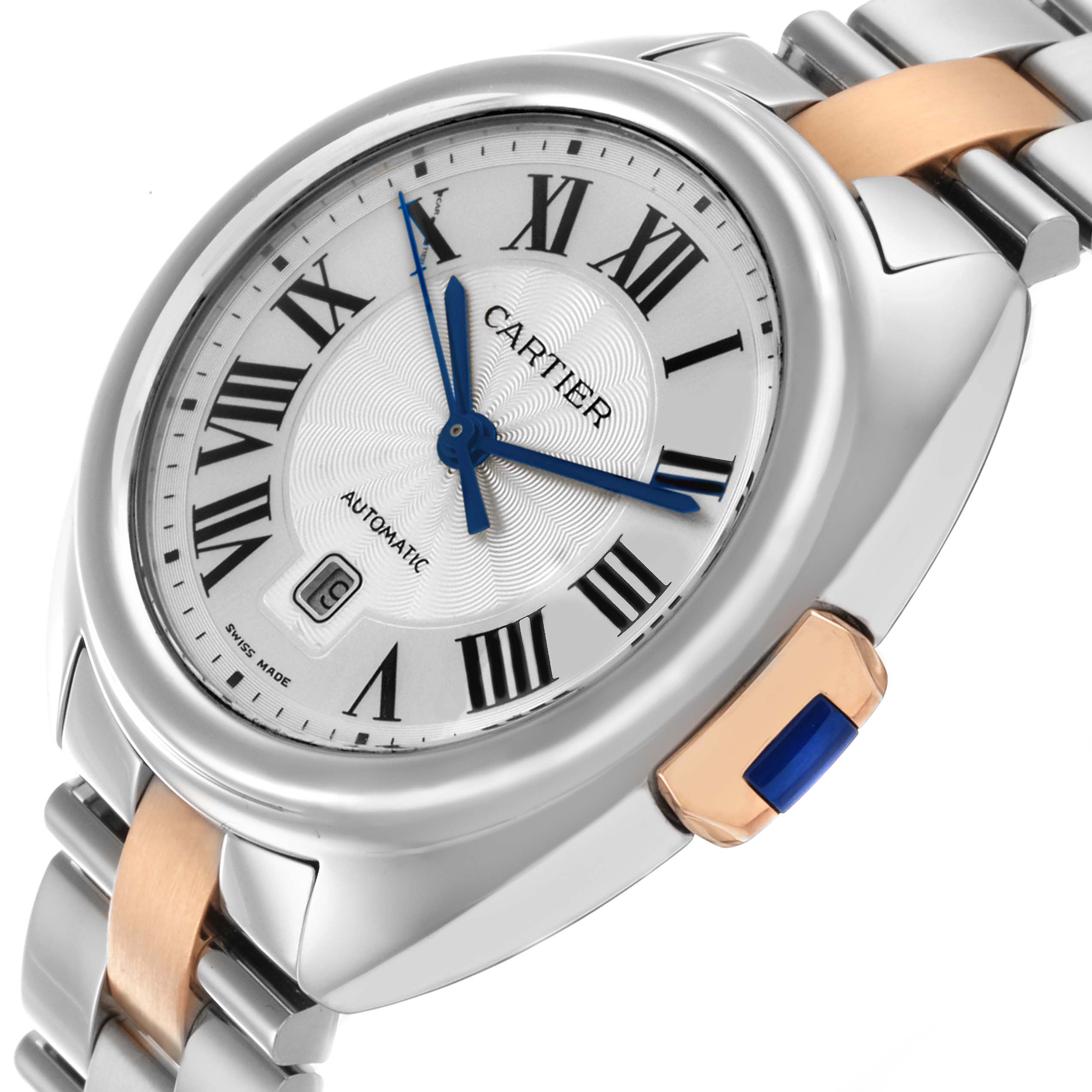 The Cartier Clé watch is shown from a diagonal angle, highlighting the face, Roman numerals, blued hands, and two-tone bracelet.