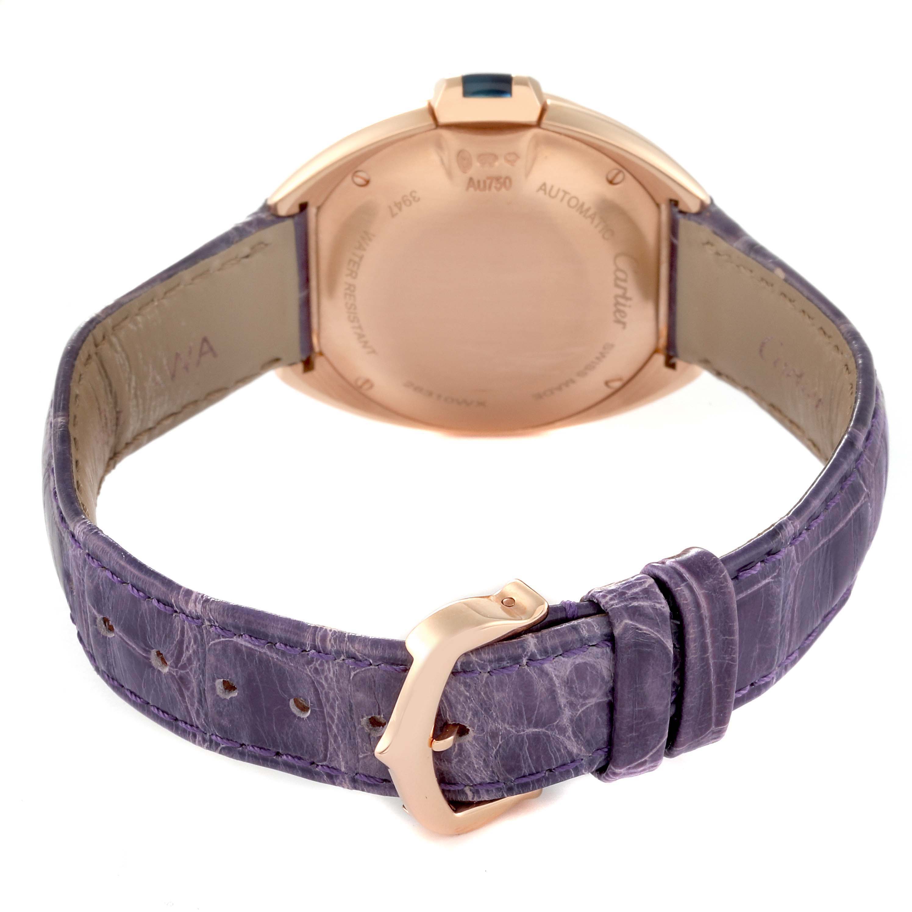 The image shows the back of the Cartier Clé model watch, highlighting the case back and purple leather strap.