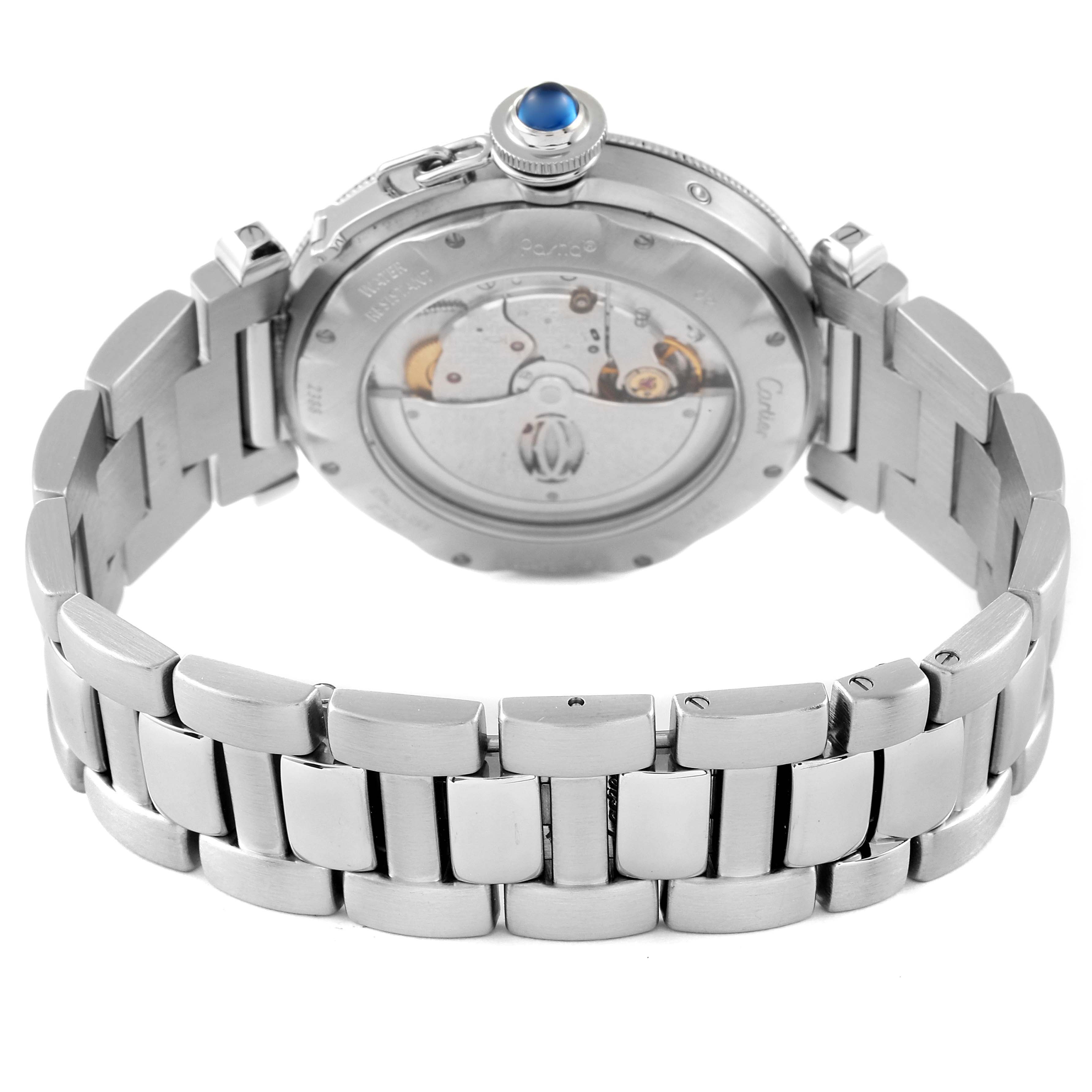 The image shows the back view of the Cartier Pasha W31037H3 Men's Stainless Steel Silver Dial W31037H3 Men's Stainless Steel Silver Dial watch, including the movement, crown, and stainless steel bracelet.
