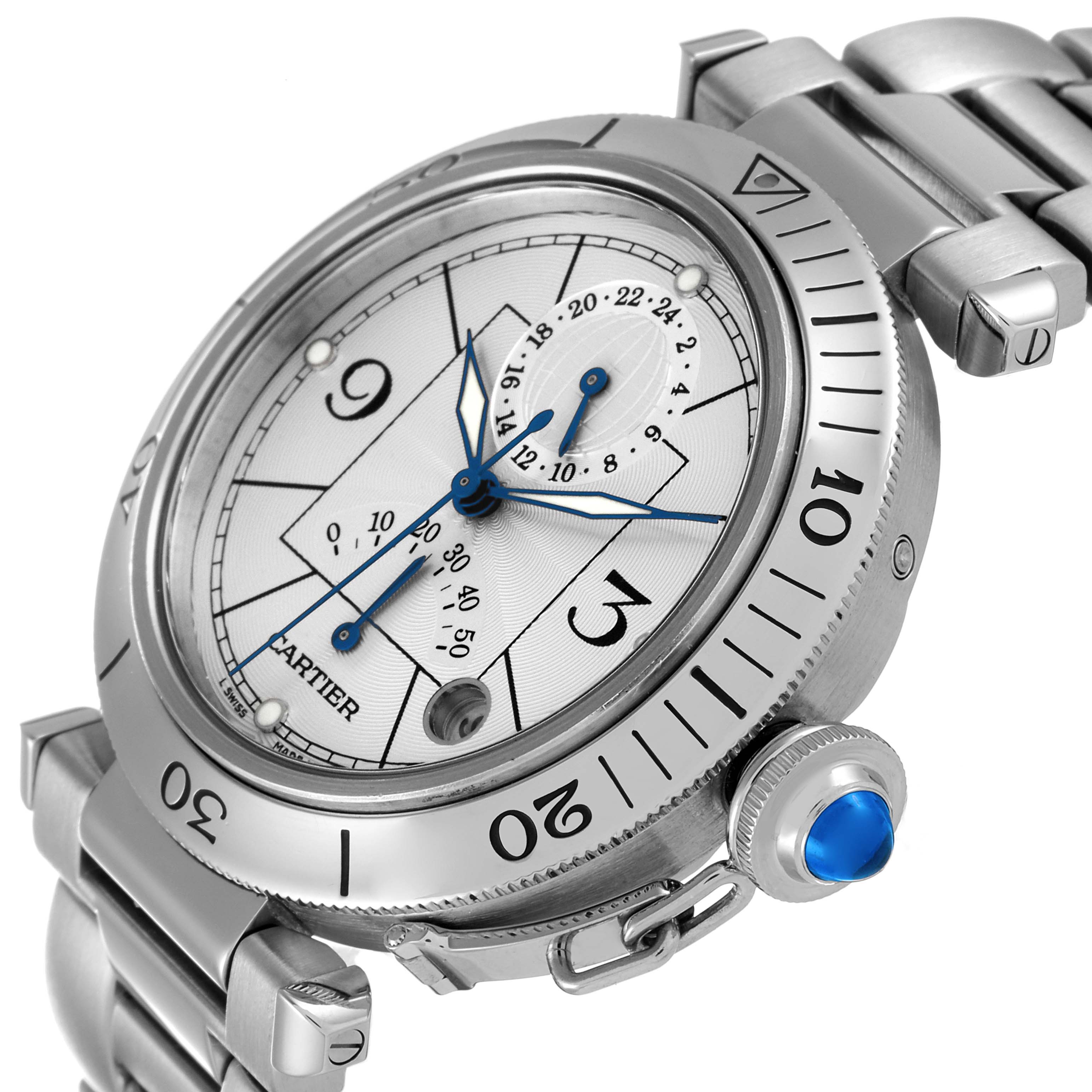 The image shows a side angle of the Cartier Pasha W31037H3 Men's Stainless Steel Silver Dial W31037H3 Men's Stainless Steel Silver Dial watch, highlighting the bezel, crown with a blue cabochon, and part of the stainless steel bracelet.