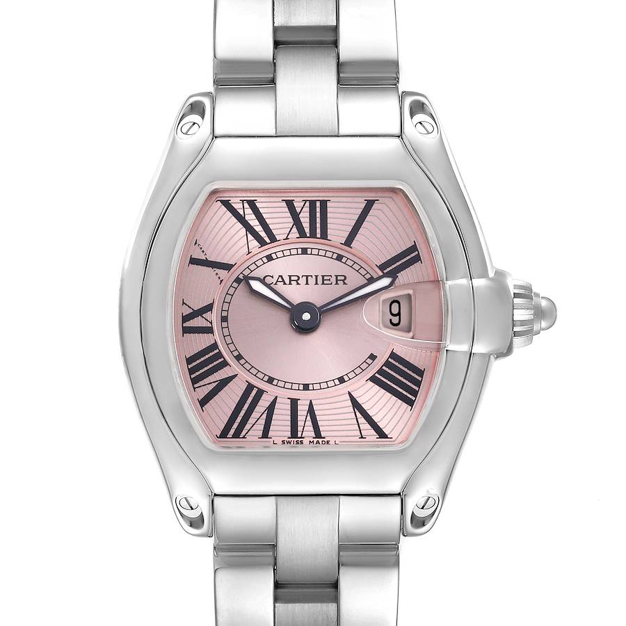 The Cartier Roadster watch is shown from a top-down angle, highlighting the face, bezel, crown, and bracelet.