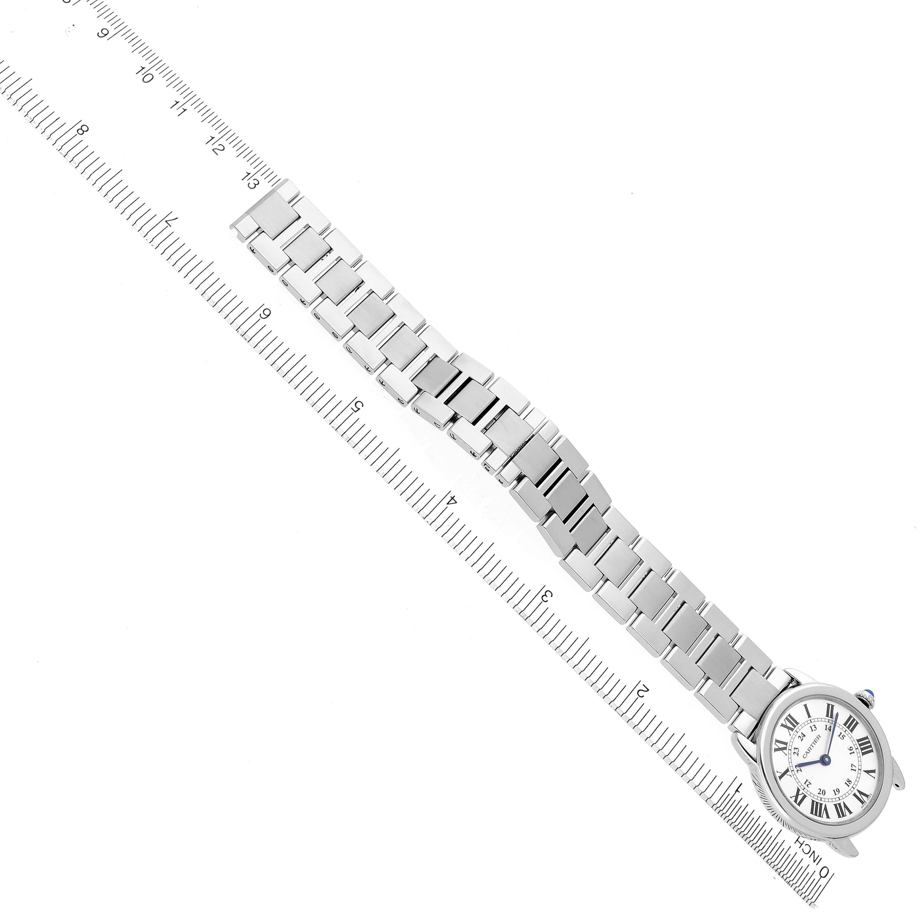 The Cartier Ronde W6701004 Women's Stainless Steel Silver Dial W6701004 Women's Stainless Steel Silver Dial watch is shown from above, highlighting its face and full metal bracelet against a ruler for scale.