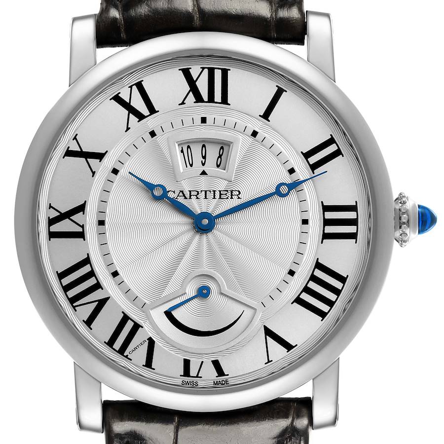 The Cartier Ronde watch is shown from the front, displaying the dial, hands, Roman numerals, and crown with a blue cabochon.