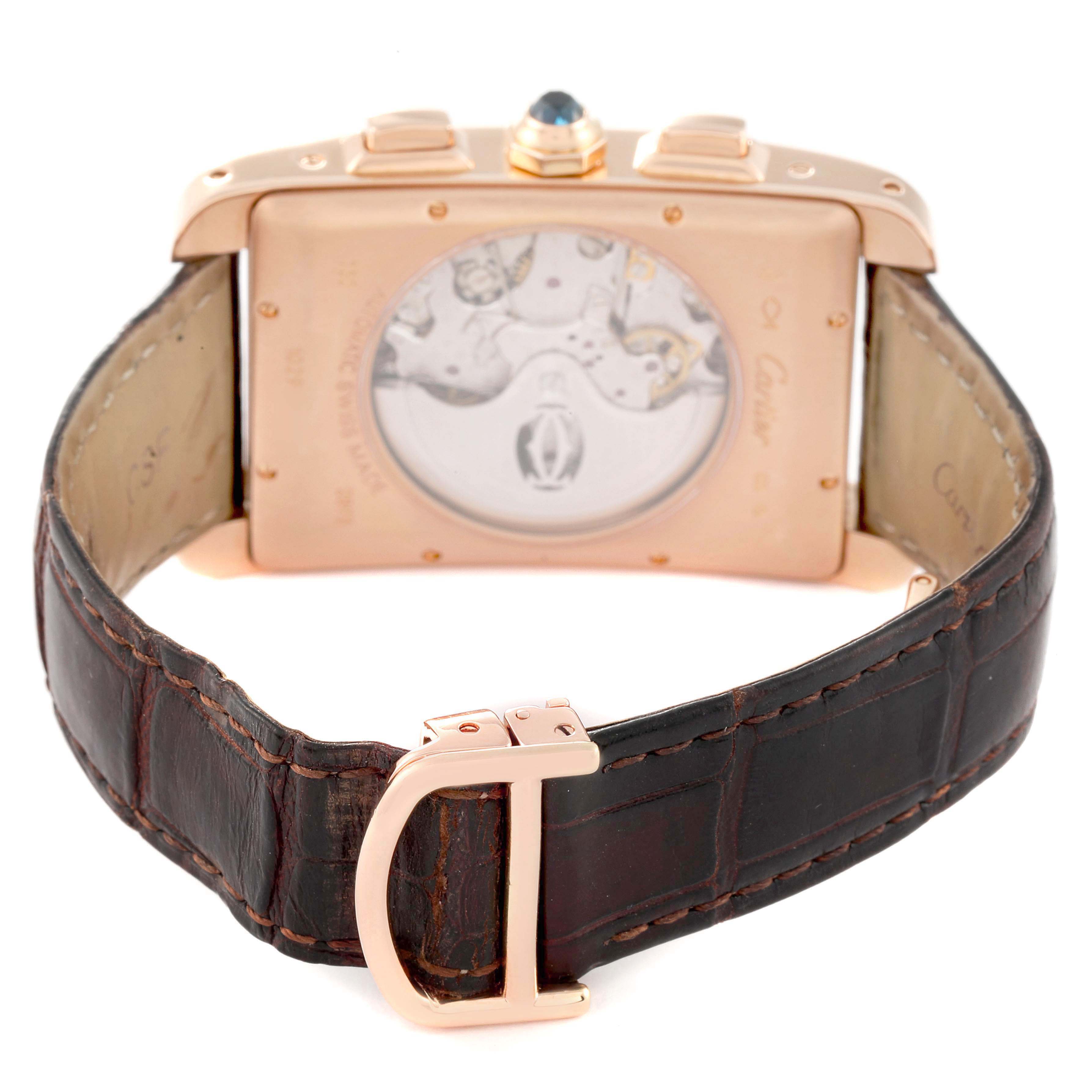 The Cartier Tank Americaine W2609356 Men's Rose Gold Silver Dial watch is shown from the back, highlighting the case, movement, and leather strap with buckle.