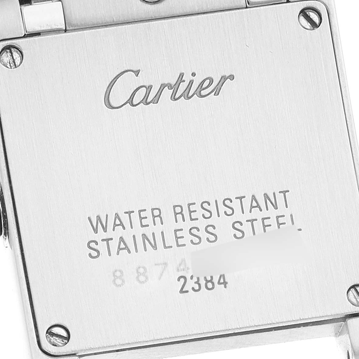 This image shows the back of a Cartier Tank Francaise W51028Q3 Women's Stainless Steel Mother of Pearl Dial W51028Q3 Women's Stainless Steel Mother of Pearl Dial watch, displaying the inscription and water resistance information.