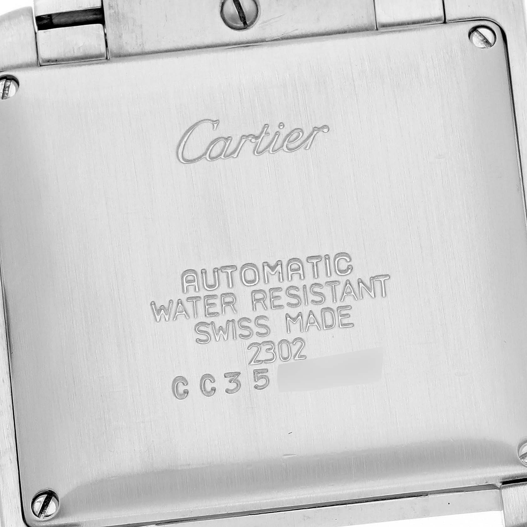 The image shows the back of the Cartier Tank Française watch, featuring engraved details.