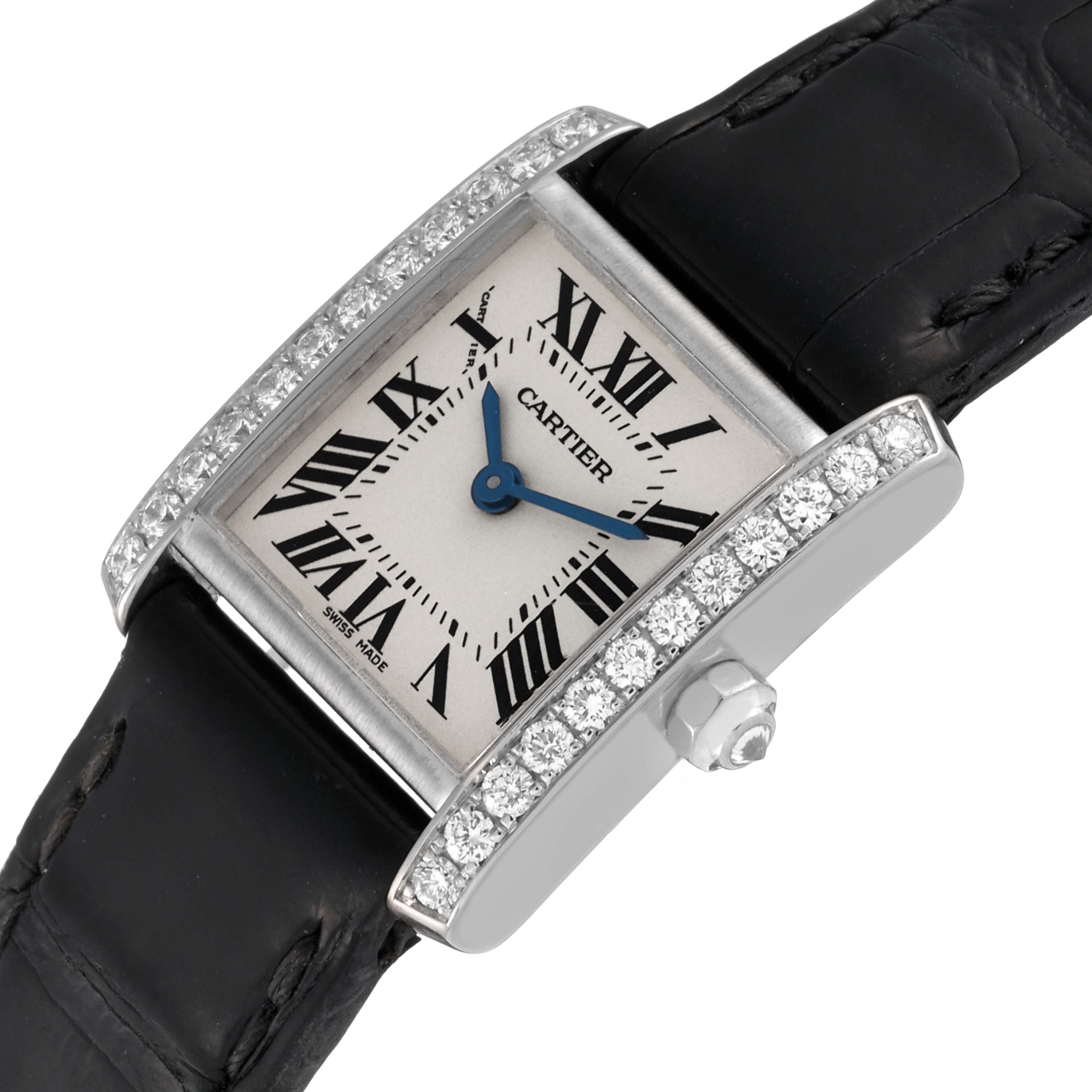 The image shows a top-angle view of a Cartier Tank Française watch, highlighting its face, strap, and diamond-set bezel.