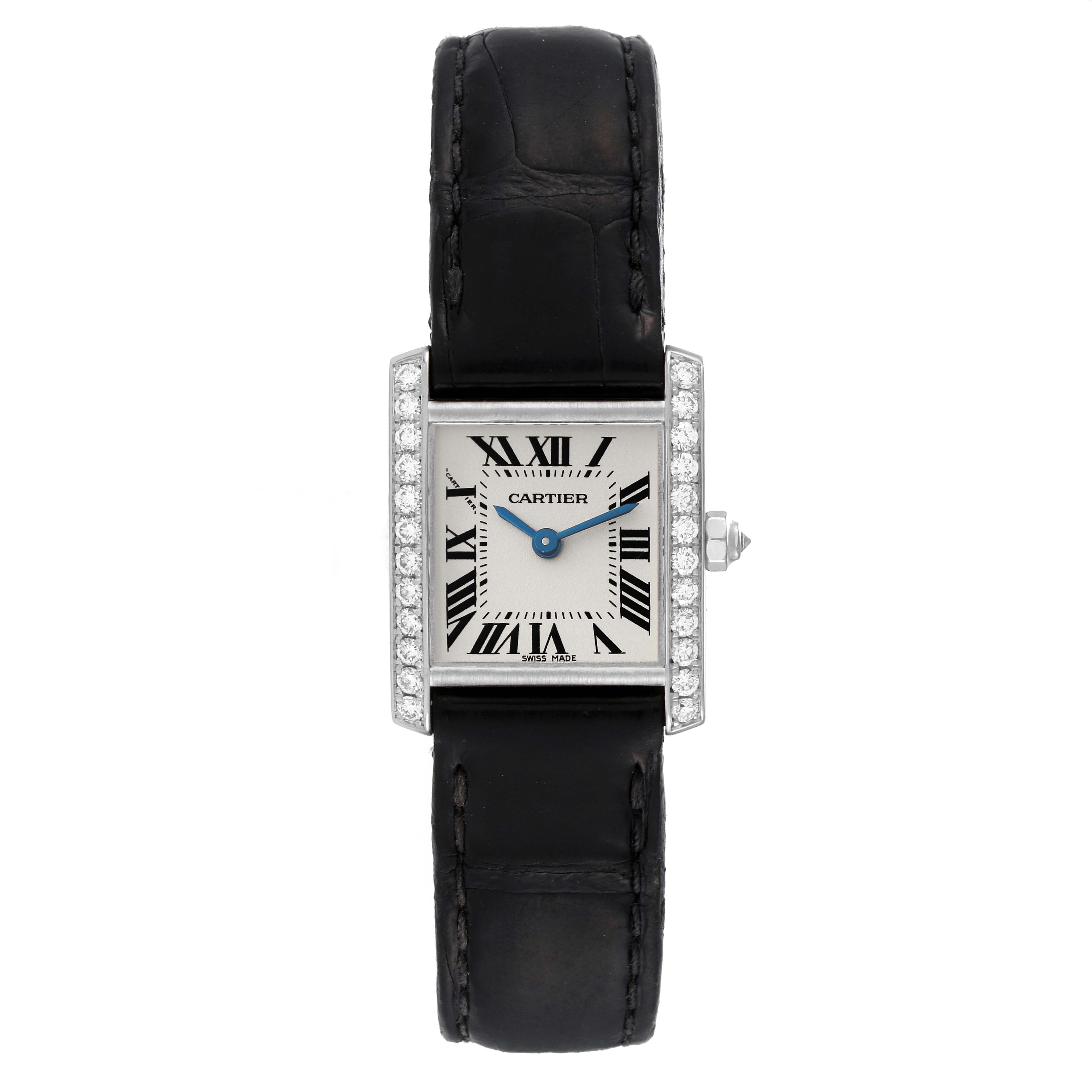 The image shows a Tank Francaise watch by Cartier, featuring a black leather strap, Roman numeral dial, and diamond-set bezel.