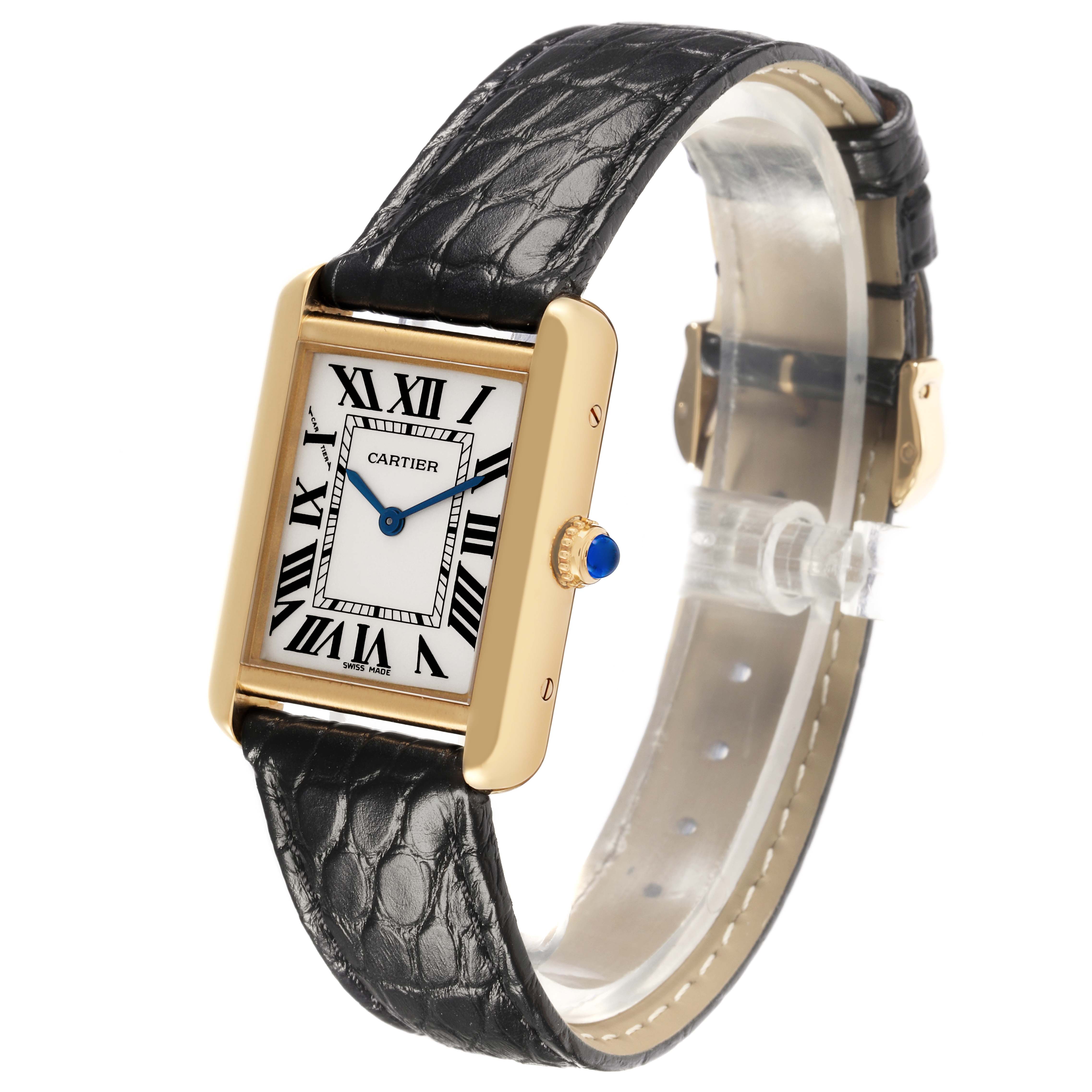 The Cartier Tank Solo W1018755 Women's Steel and Gold (two tone) Silver Dial W1018755 Women's Steel and Gold (two tone) Silver Dial watch is shown at an angle displaying its face, gold case, black leather strap, and blue cabochon crown.