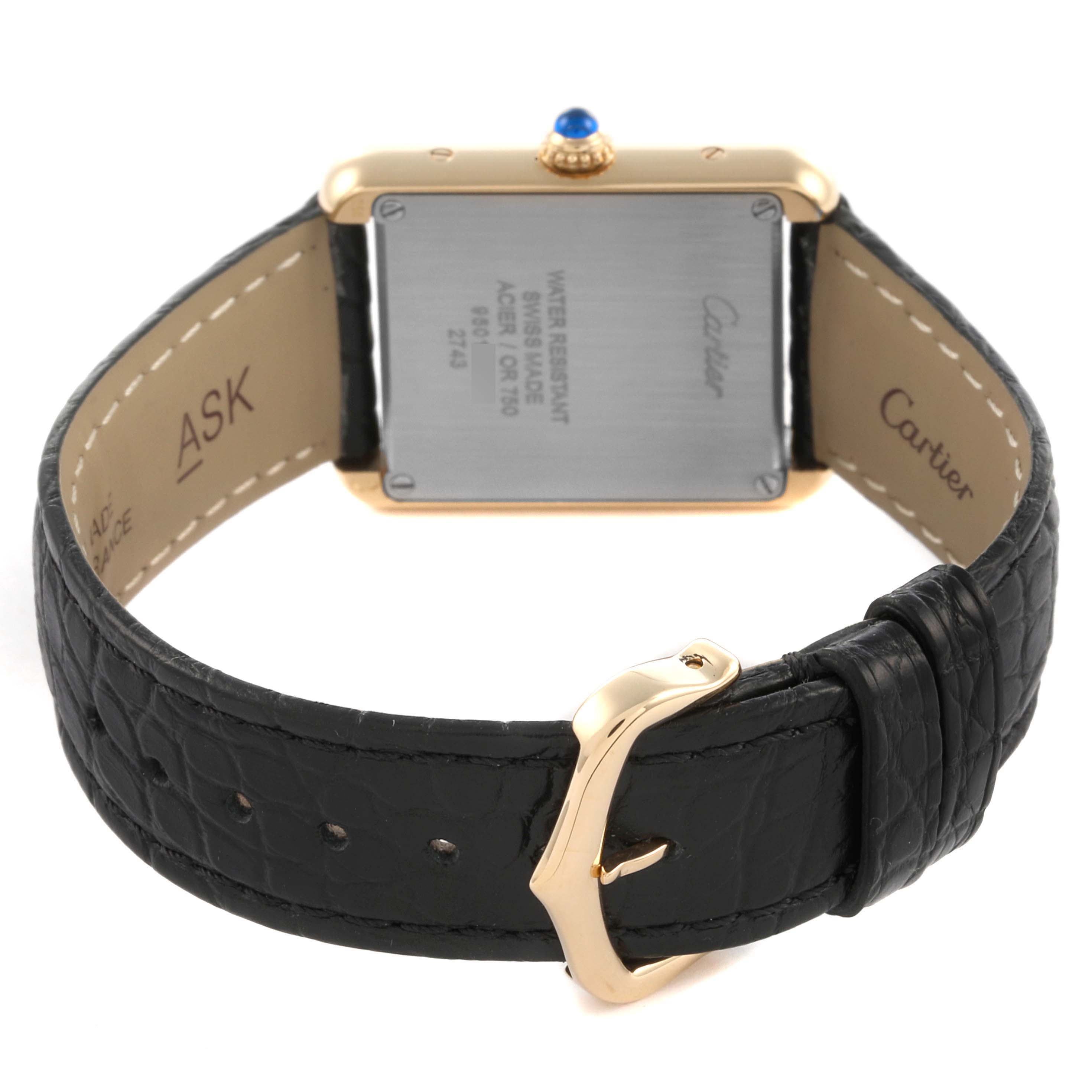 The Cartier Tank Solo W1018755 Women's Steel and Gold (two tone) Silver Dial W1018755 Women's Steel and Gold (two tone) Silver Dial watch is shown from the back, highlighting its case, strap, and buckle.