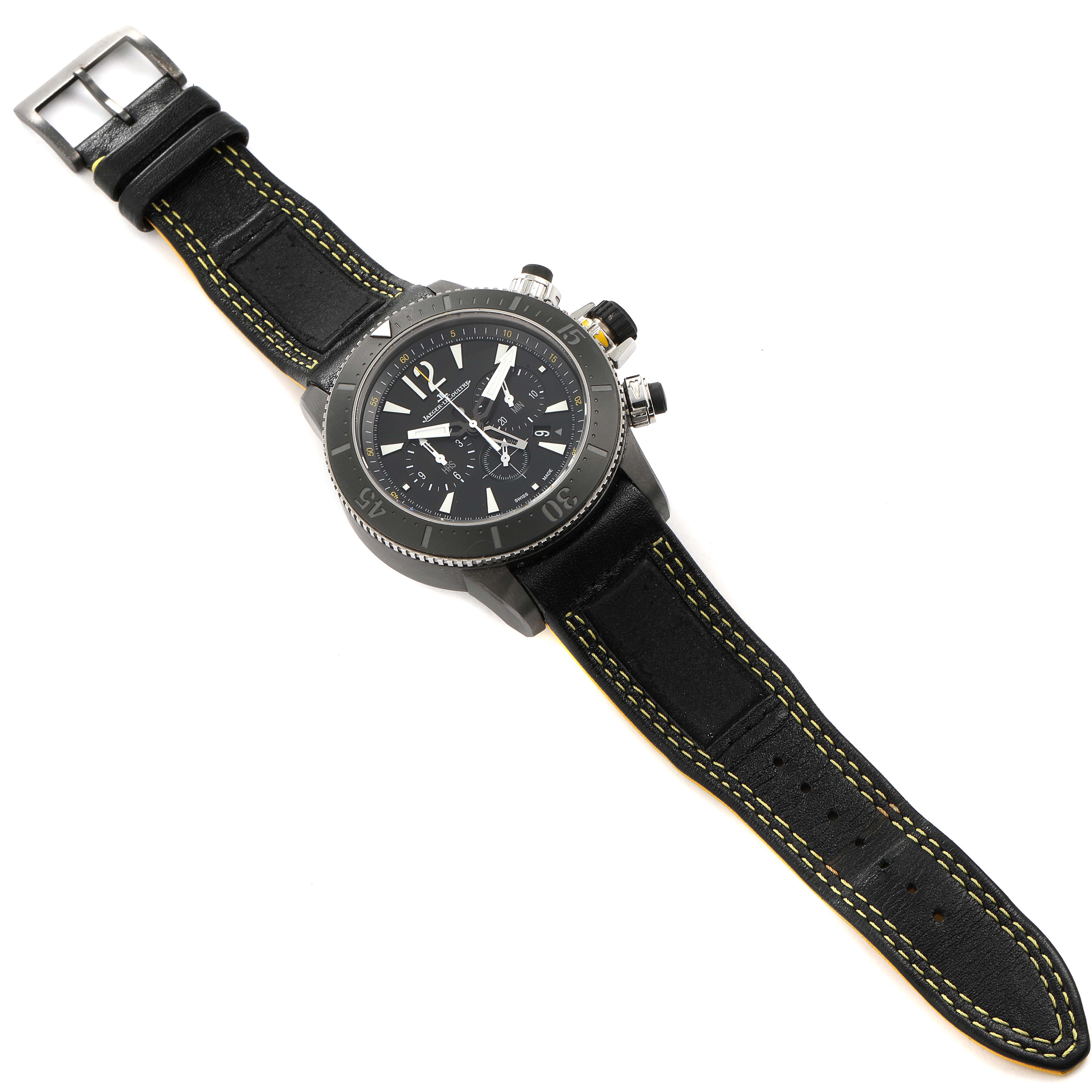 The Jaeger-LeCoultre Master model watch is shown from a top-down angle, highlighting its face, bezel, and leather strap.