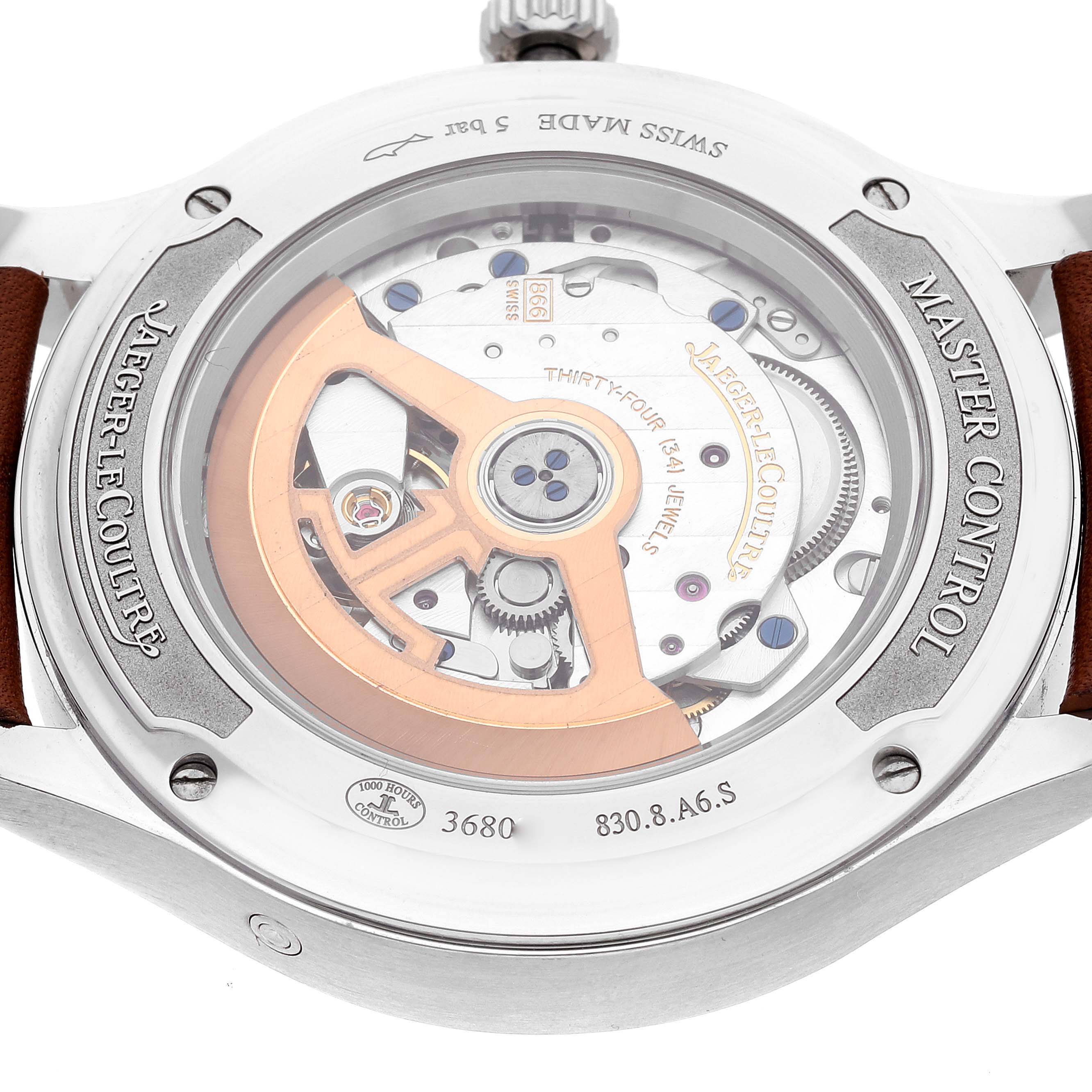 The image shows a close-up of the open case back of a Jaeger LeCoultre Master Q4148420 Men's Stainless Steel Silver Dial Q4148420 Men's Stainless Steel Silver Dial Control watch, revealing its intricate movement.