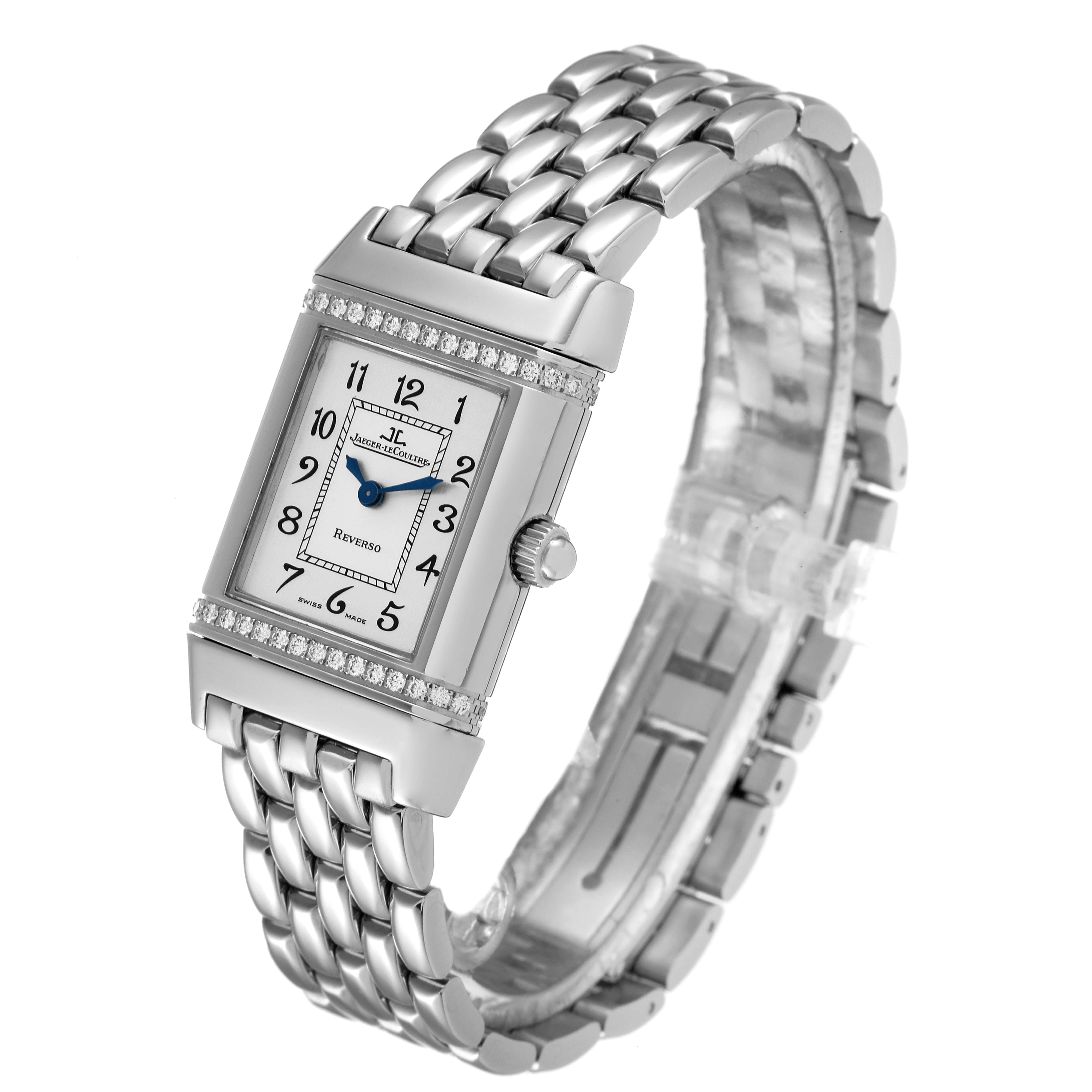 The image shows a Jaeger-LeCoultre Reverso watch at an angle, highlighting its rectangular face, dial, crown, and metal bracelet.