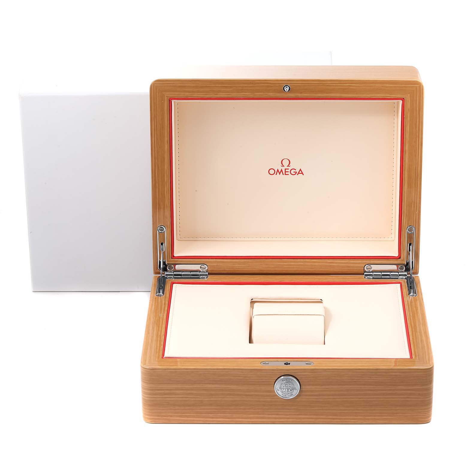 The image shows an open wooden Omega watch box for the Planet Ocean model, showcasing its interior with a central watch holder.
