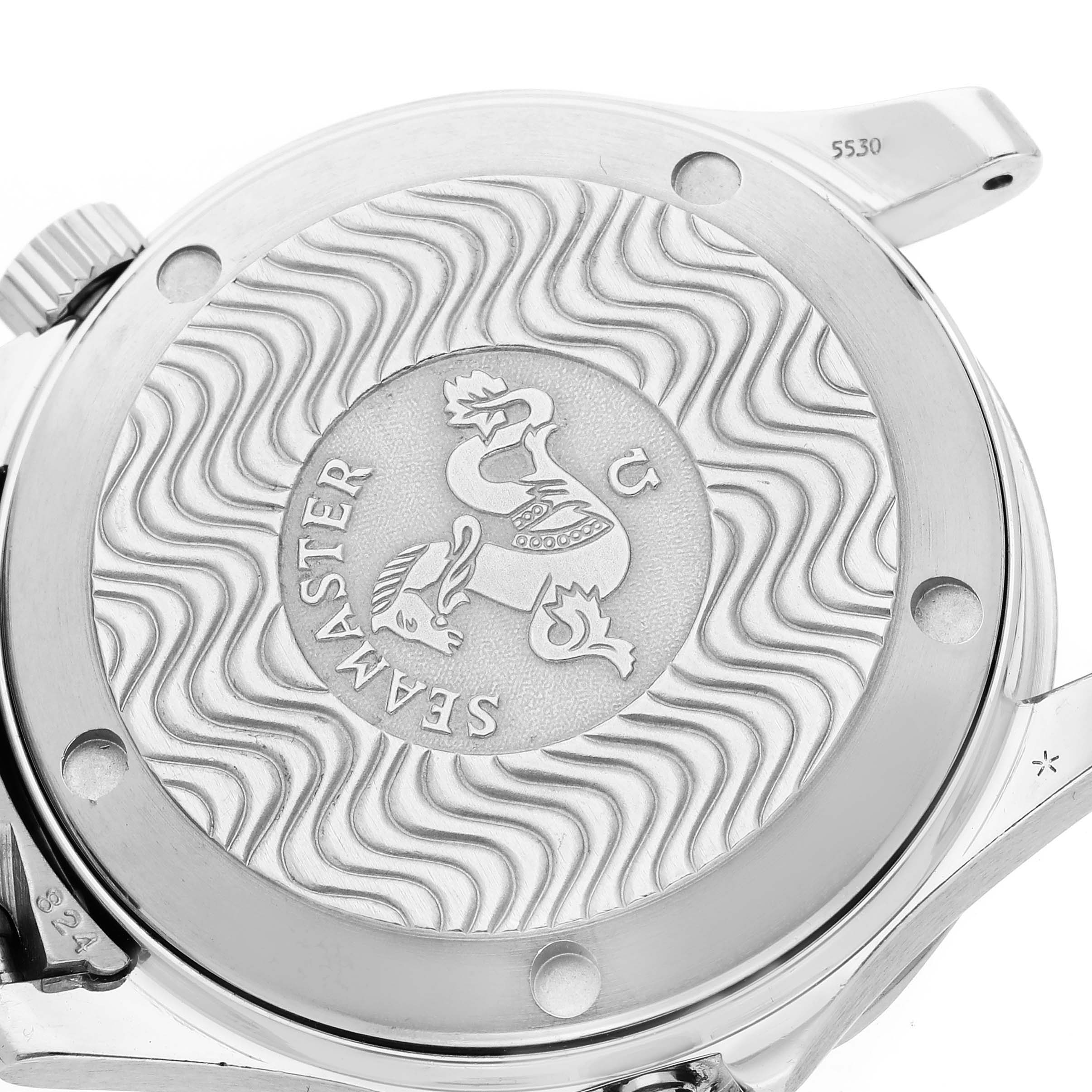 The image shows the case back of an Omega Seamaster 2562.80.00 Men
s Stainless Steel Blue Dial 2562.80.00 Men
s Stainless Steel Blue Dial watch with its engraved design and wave pattern.