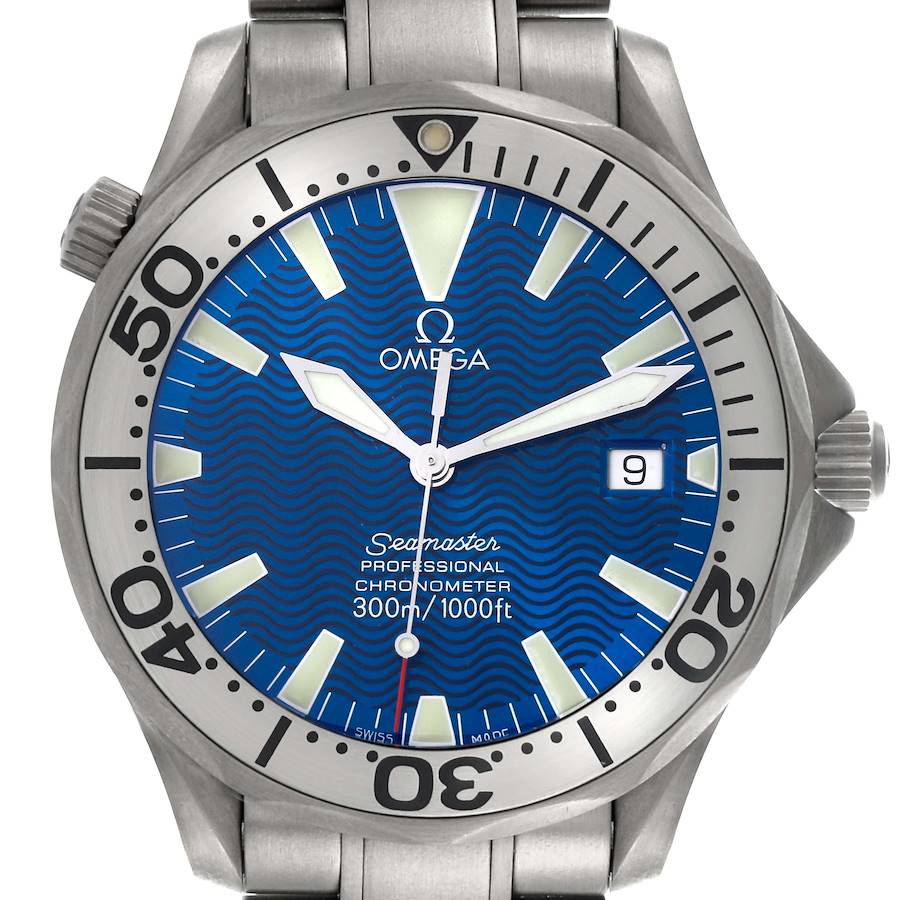 The Omega Seamaster watch is shown from the front, highlighting its blue dial, bezel, and date display.