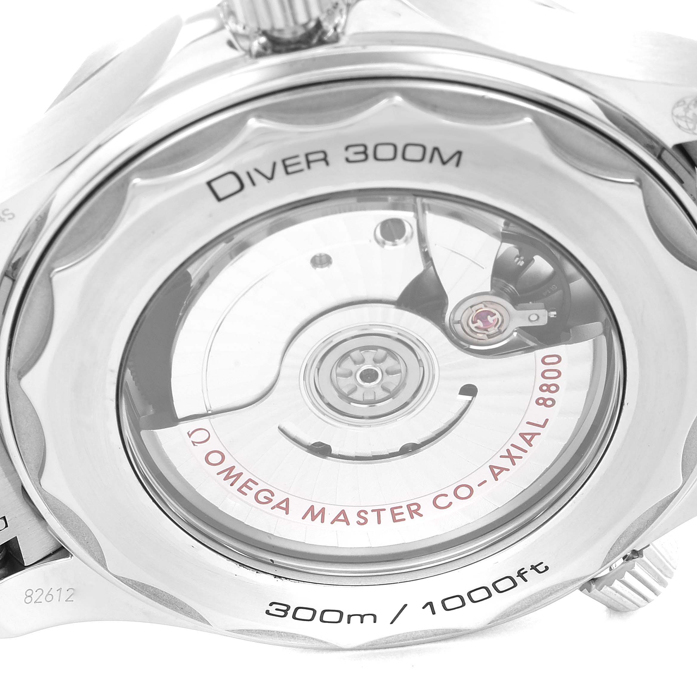 The image shows the back of an Omega Seamaster 210.30.42.20.03.001 Men's Stainless Steel Blue Dial 210.30.42.20.03.001 Men's Stainless Steel Blue Dial Diver 300M, highlighting its Co-Axial 8800 movement and 300m/1000ft water resistance.