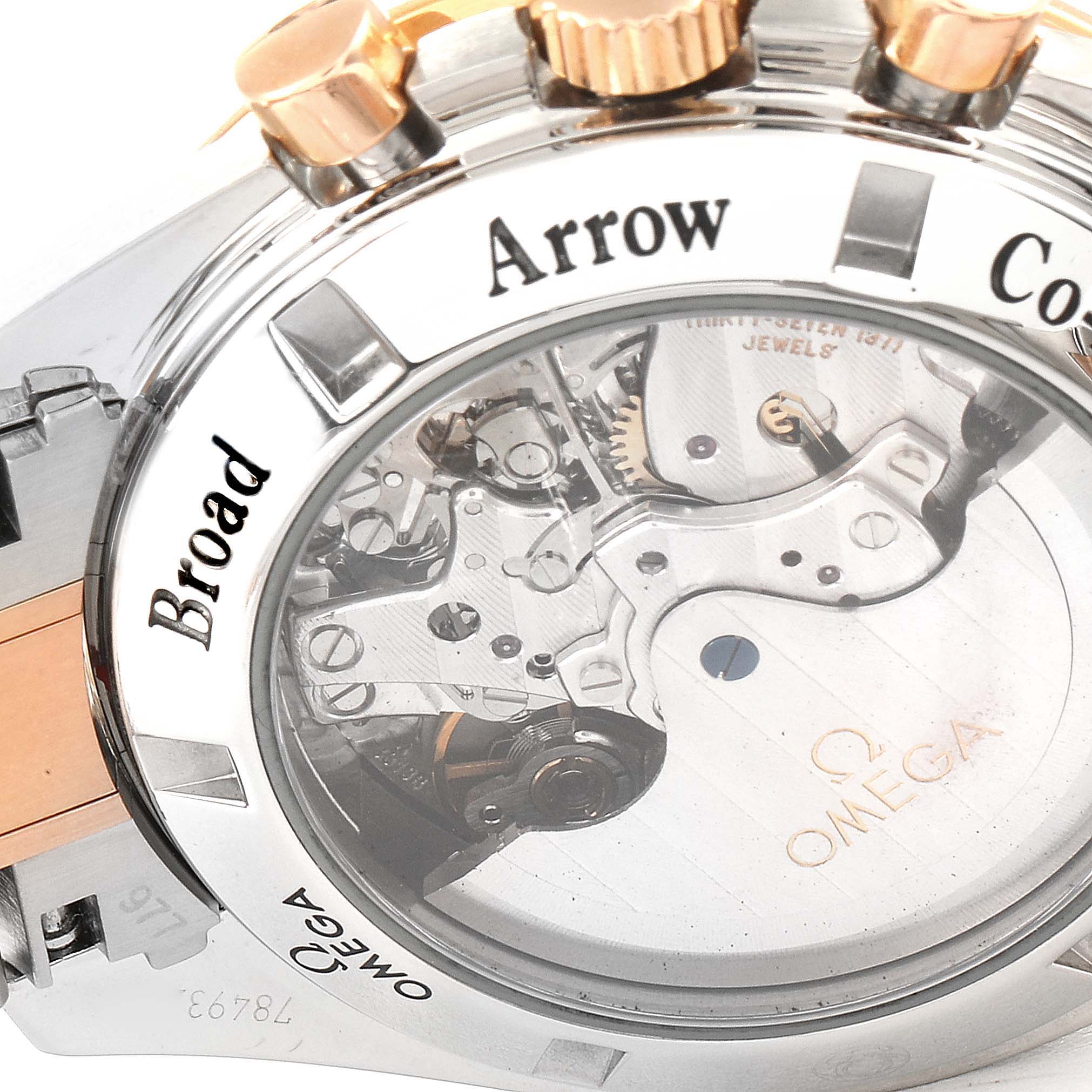 The image shows a close-up of the case back and movement of an Omega Speedmaster 321.90.42.50.13.001 Men's Steel and Gold (two tone) Brown Dial 321.90.42.50.13.001 Men's Steel and Gold (two tone) Brown Dial Broad Arrow watch.