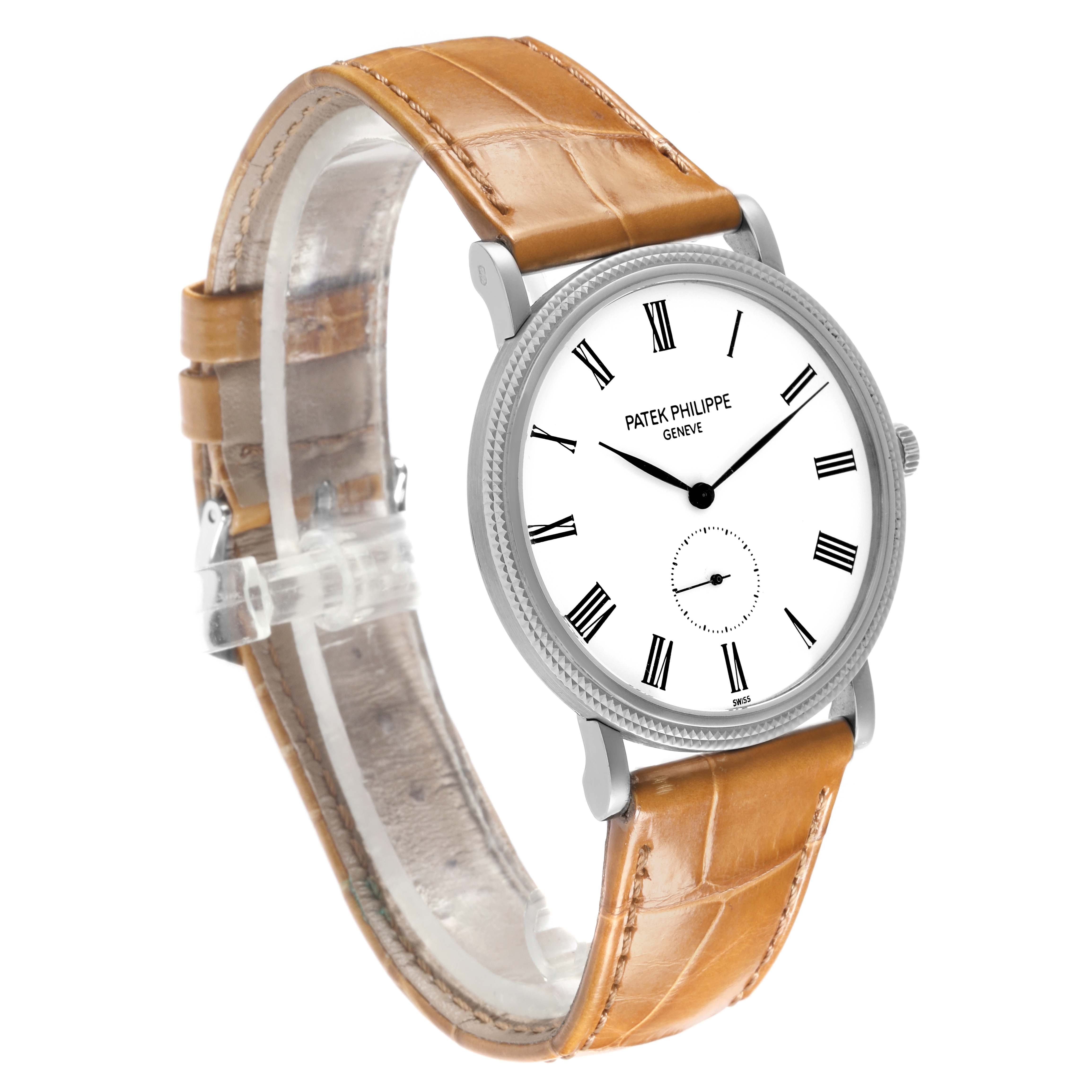 The Patek Philippe Calatrava 5119G-001 Men
s White Gold White Dial 5119G-001 Men
s White Gold White Dial watch is shown at a slight angle displaying the face, bezel, crown, and brown leather strap.